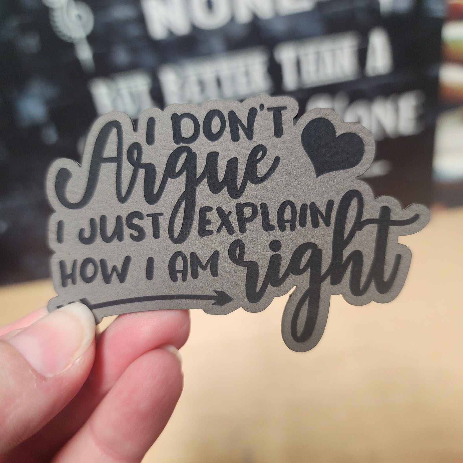 Leatherette hat patch with humorous quote 'I Don't Argue, I Just Explain How I Am Right' for unique accessory lovers.