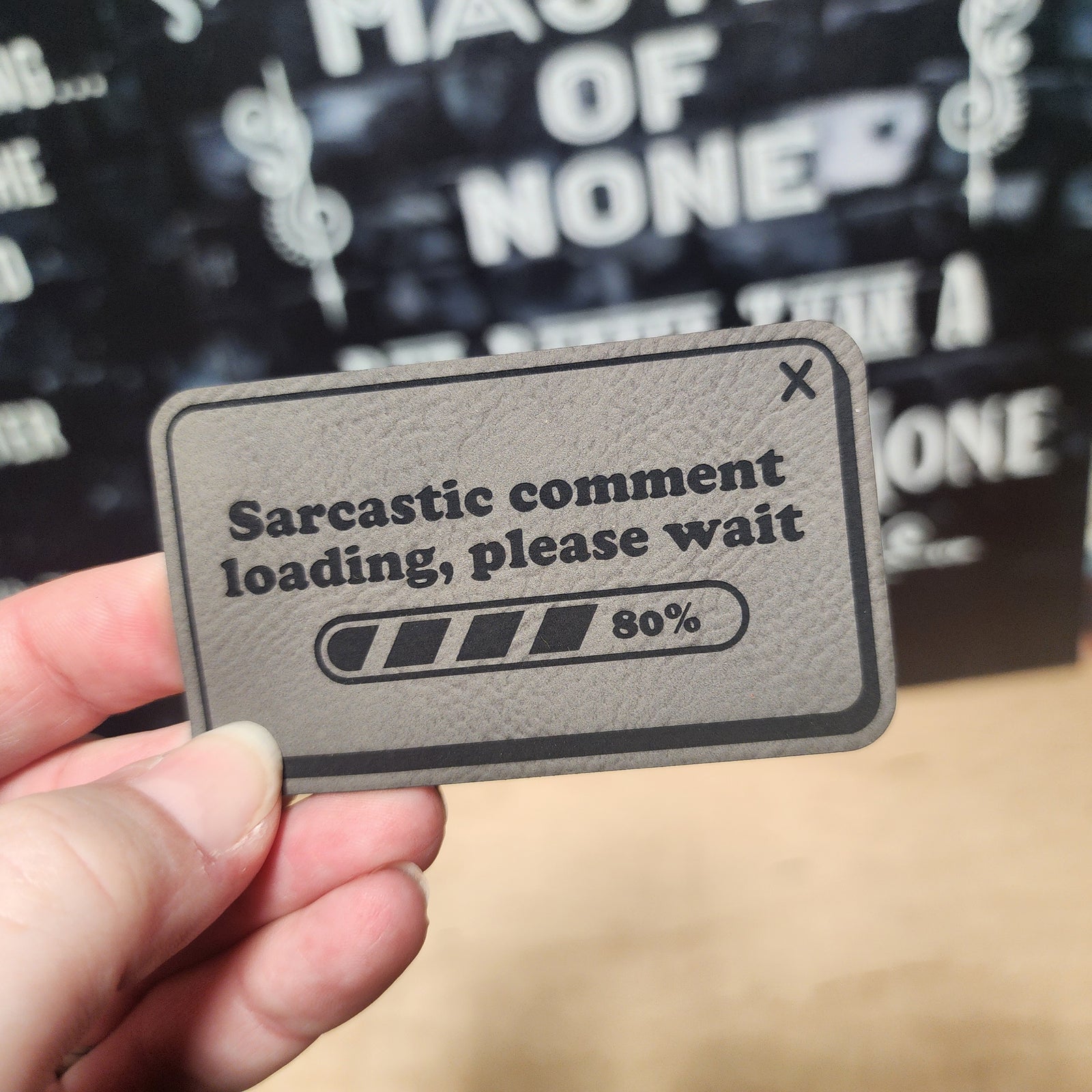 Sarcastic comment loading leatherette hat patch for witty hat lovers and humor enthusiasts.