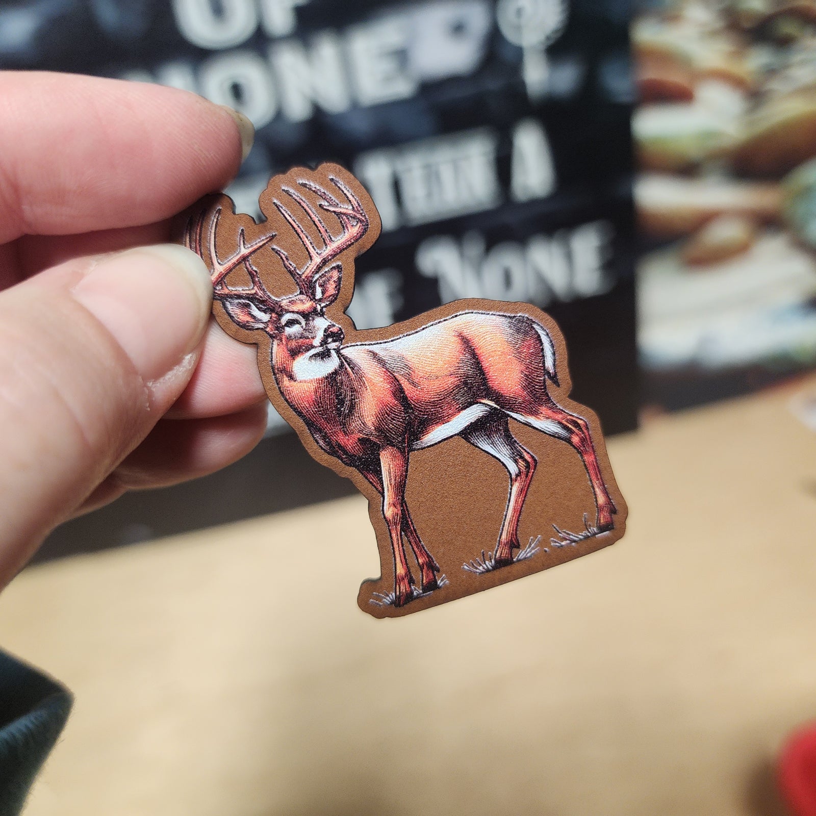 Hunting themed leatherette hat patch featuring a majestic deer design, perfect for outdoor enthusiasts.