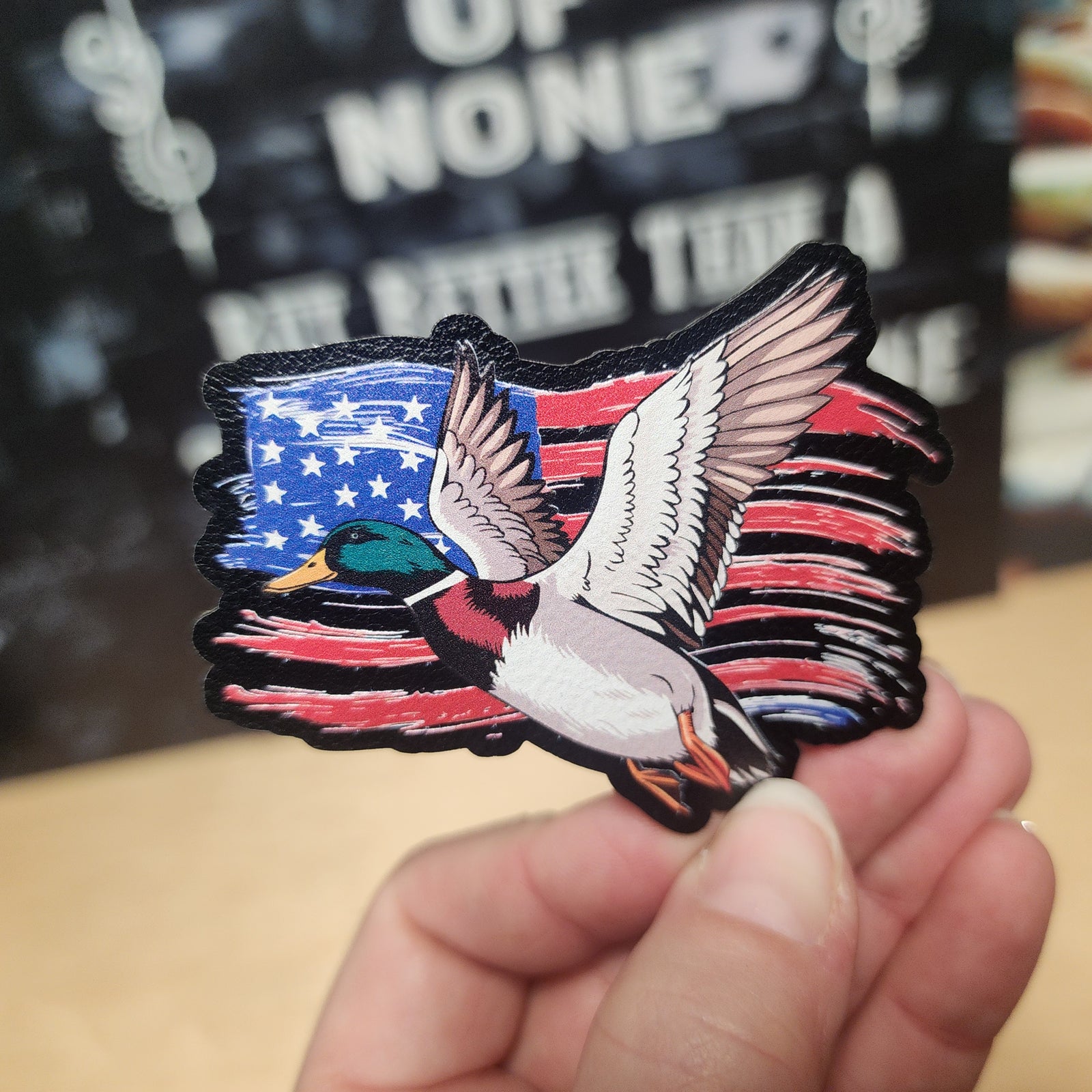 USA flag leatherette hat patch with a flying mallard duck, perfect for outdoors and patriotic accessories.