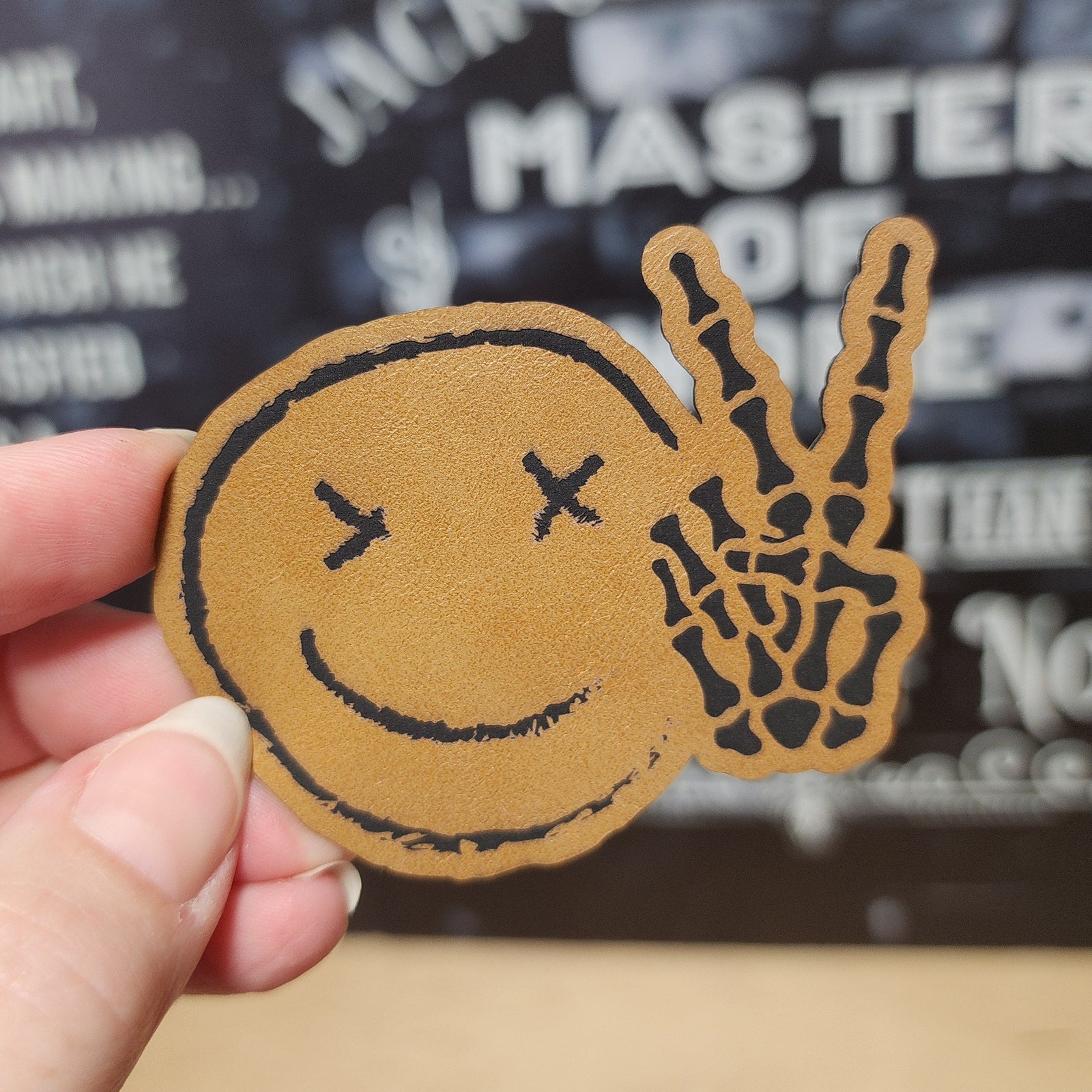Leatherette peace sign smiley face hat patch for trendy style and casual accessories.