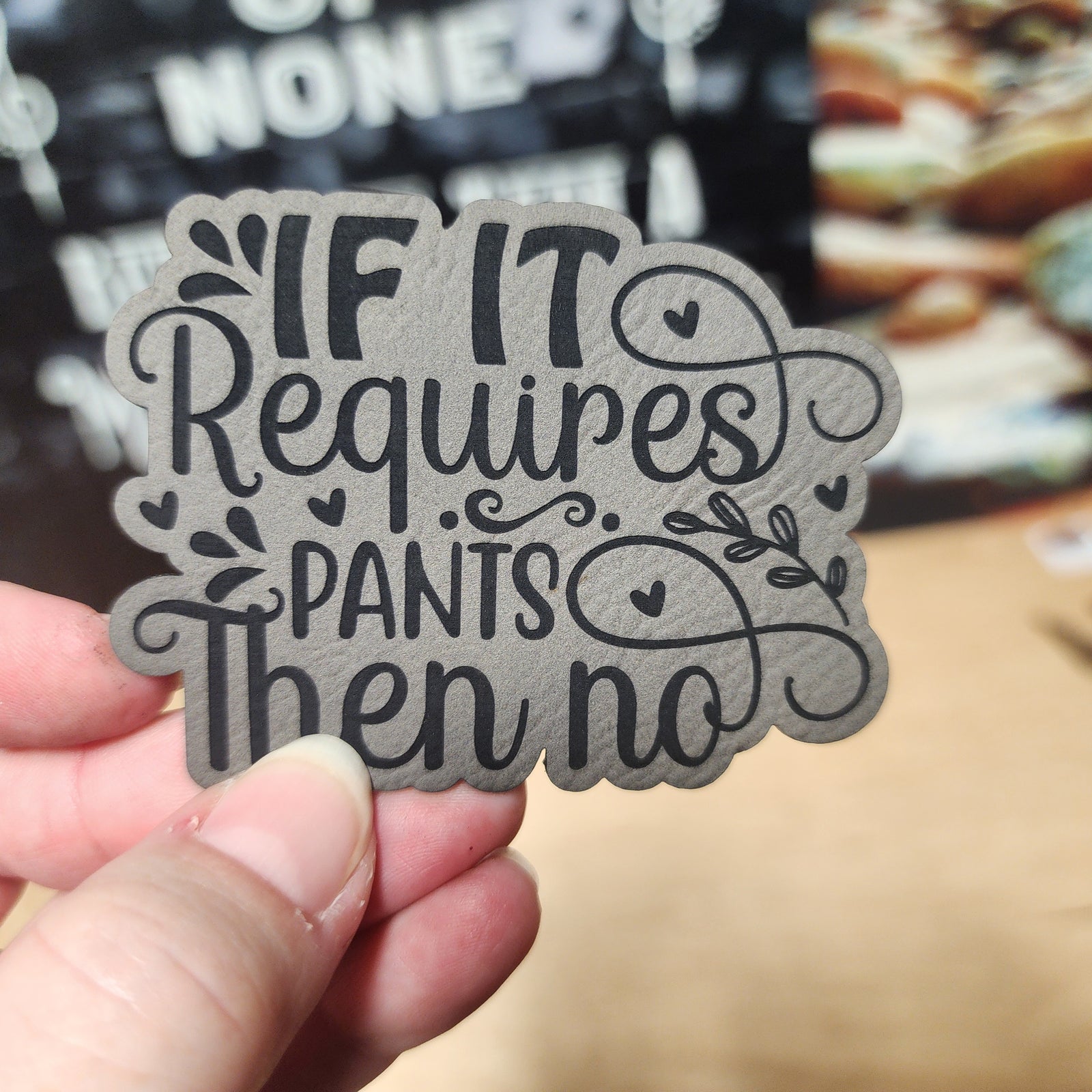 Funny leatherette hat patch saying 'If it requires pants, then no' for casual humor lovers.
