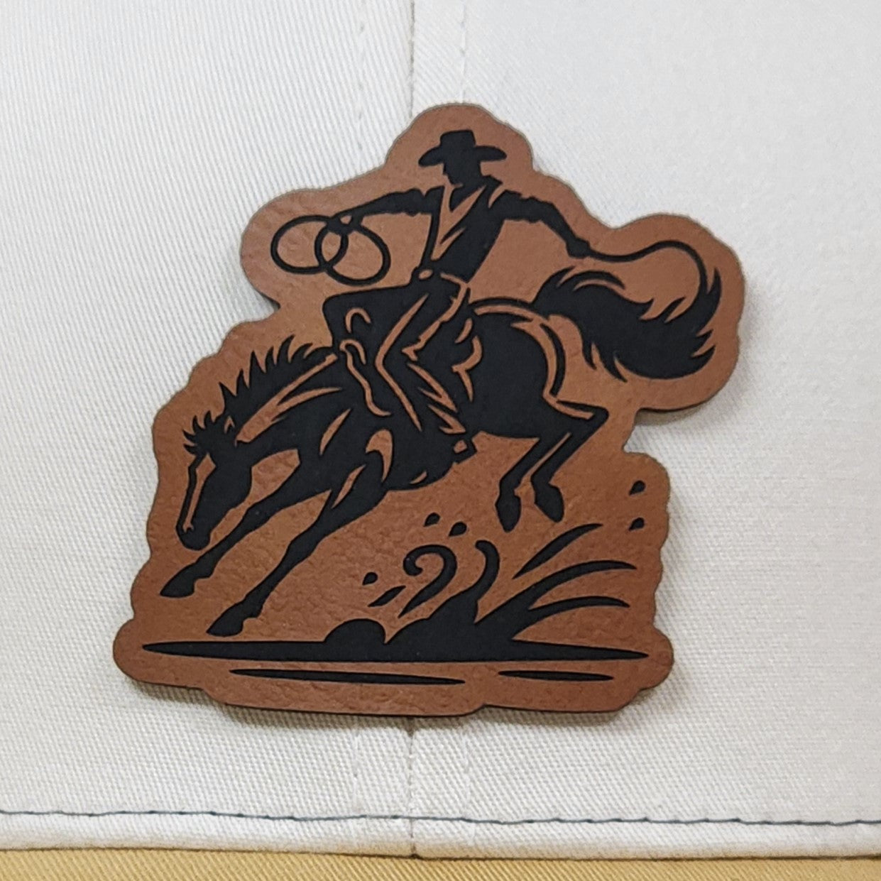 Cowboy with lasso leatherette hat patch, perfect for western vibe caps and rodeo enthusiasts.