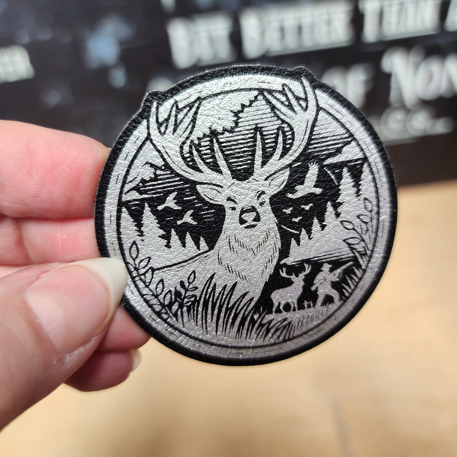 Wildlife leatherette hat patch featuring a majestic deer in a detailed forest scene, perfect for outdoor enthusiasts.