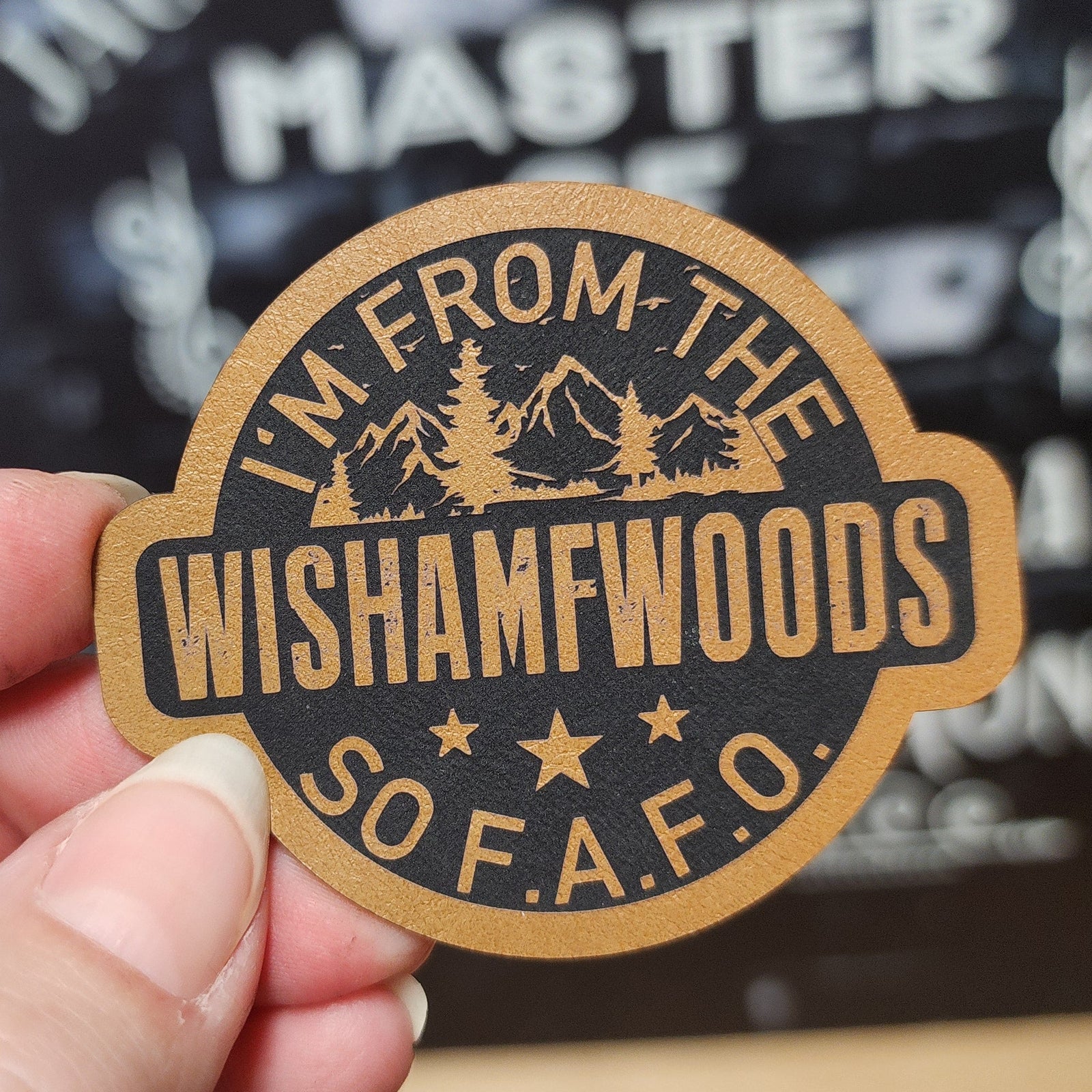 Wishamwoods leatherette hat patch for outdoor lovers, rustic fashion accessory, unique camping gear.