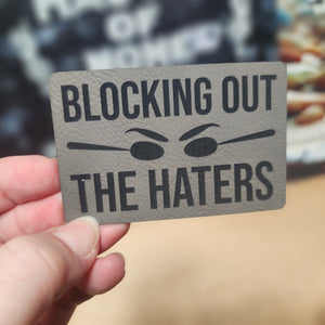 Blocking Out the Haters leatherette hat patch for expressive headwear, perfect for personalizing caps and hats.