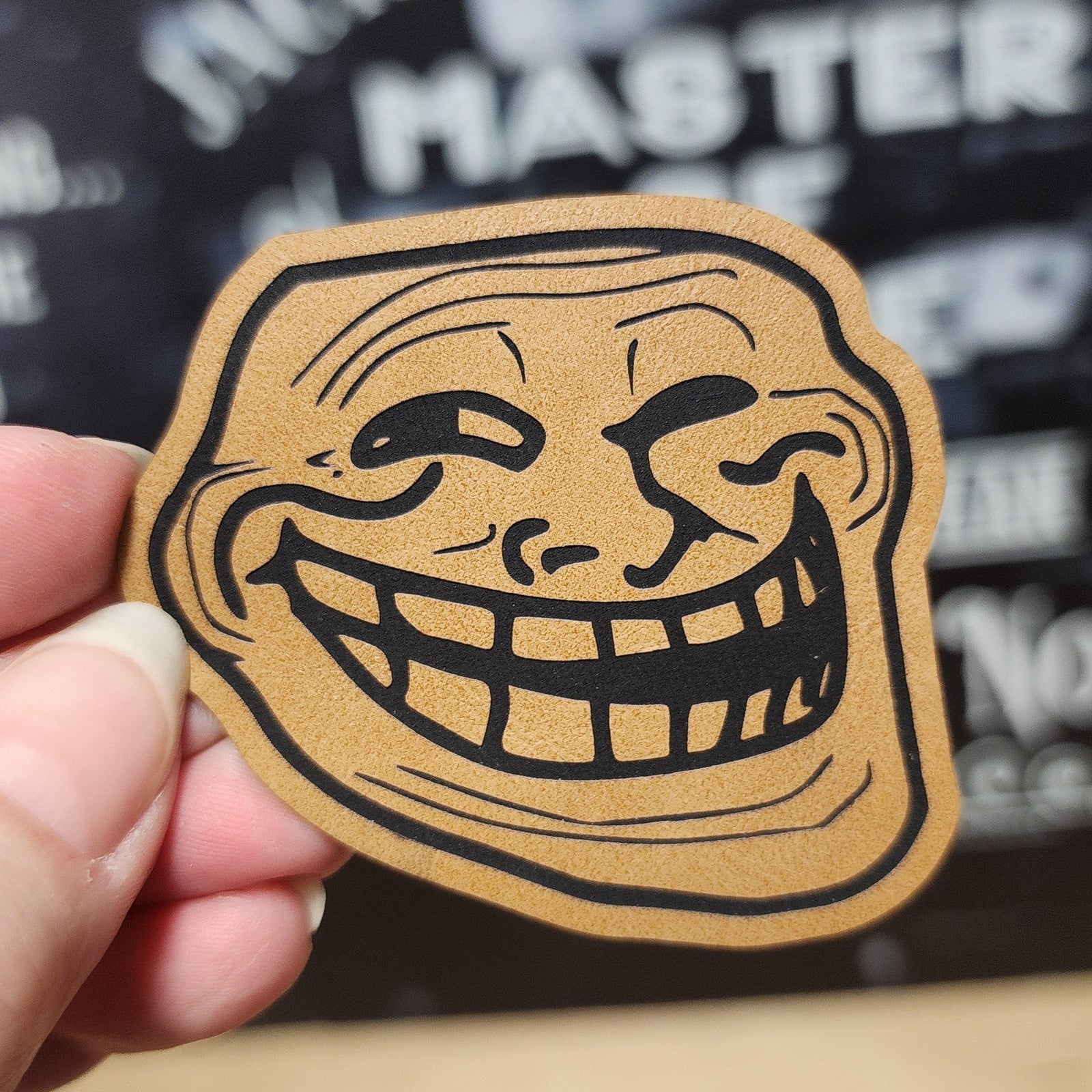 Leatherette meme hat patch featuring a classic troll face for humor and fun fashion accessories.