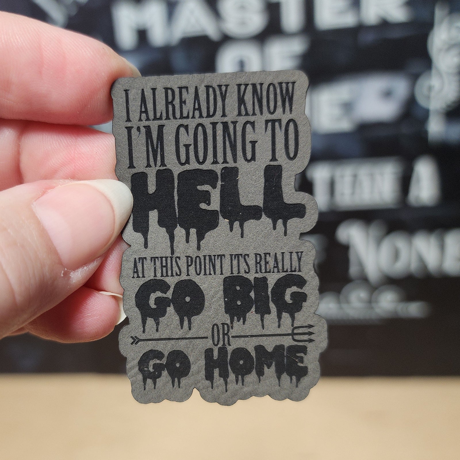 Leatherette hat patch with bold text: 'Going to Hell, Go Big or Go Home' for edgy fashion and statement accessories.