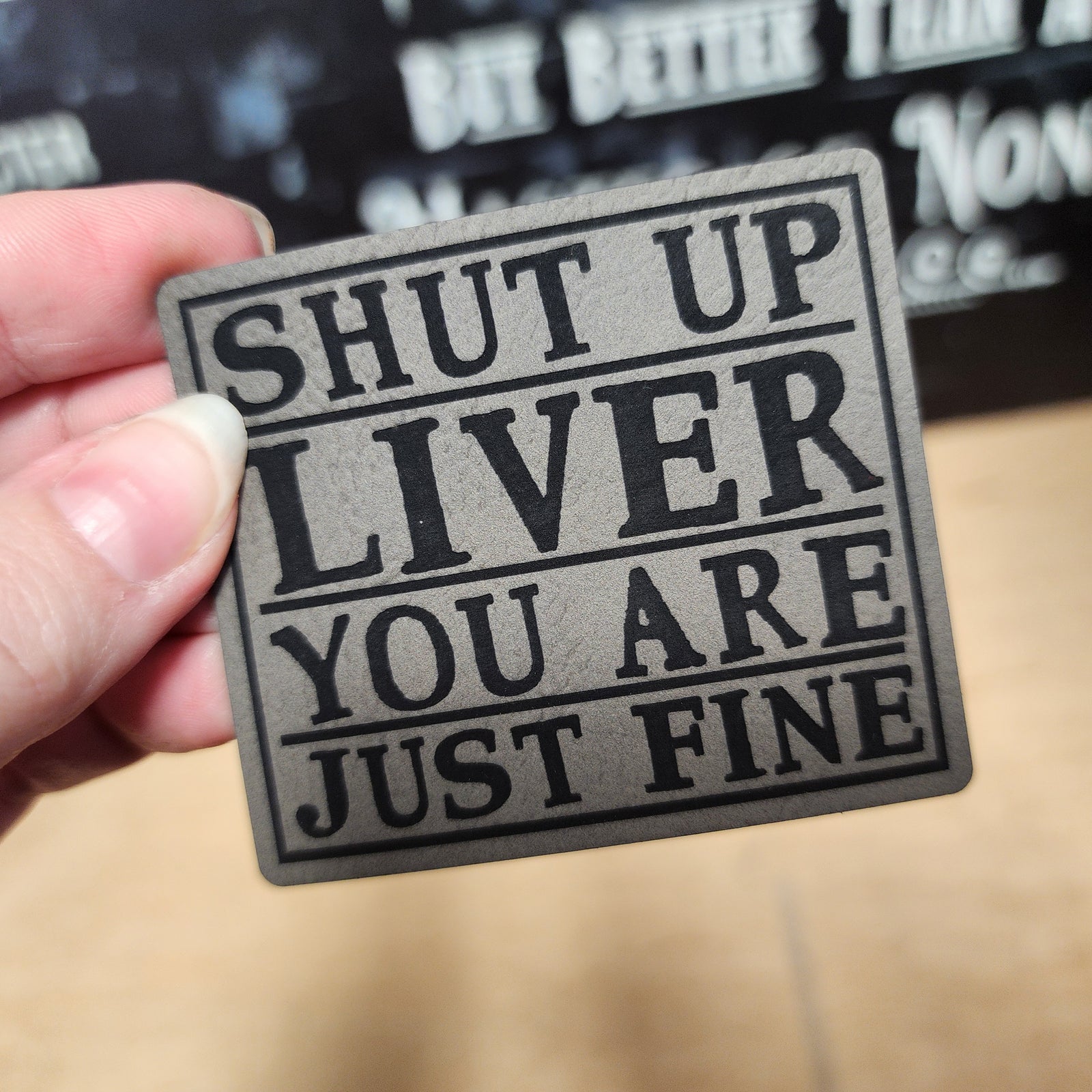 Funny leatherette hat patch that says "Shut Up Liver, You Are Just Fine" perfect for quirky hats and gifts.