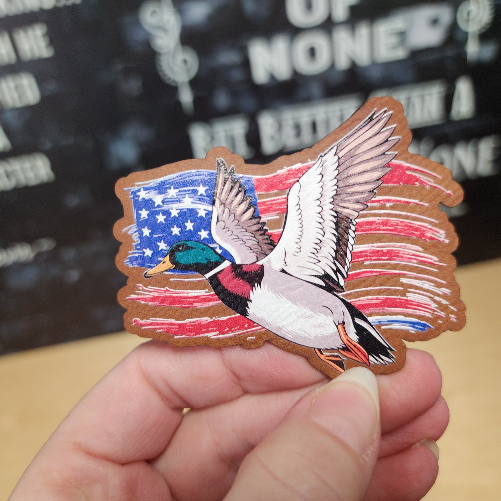 USA flag leatherette hat patch with a flying mallard duck, perfect for outdoors and patriotic accessories.