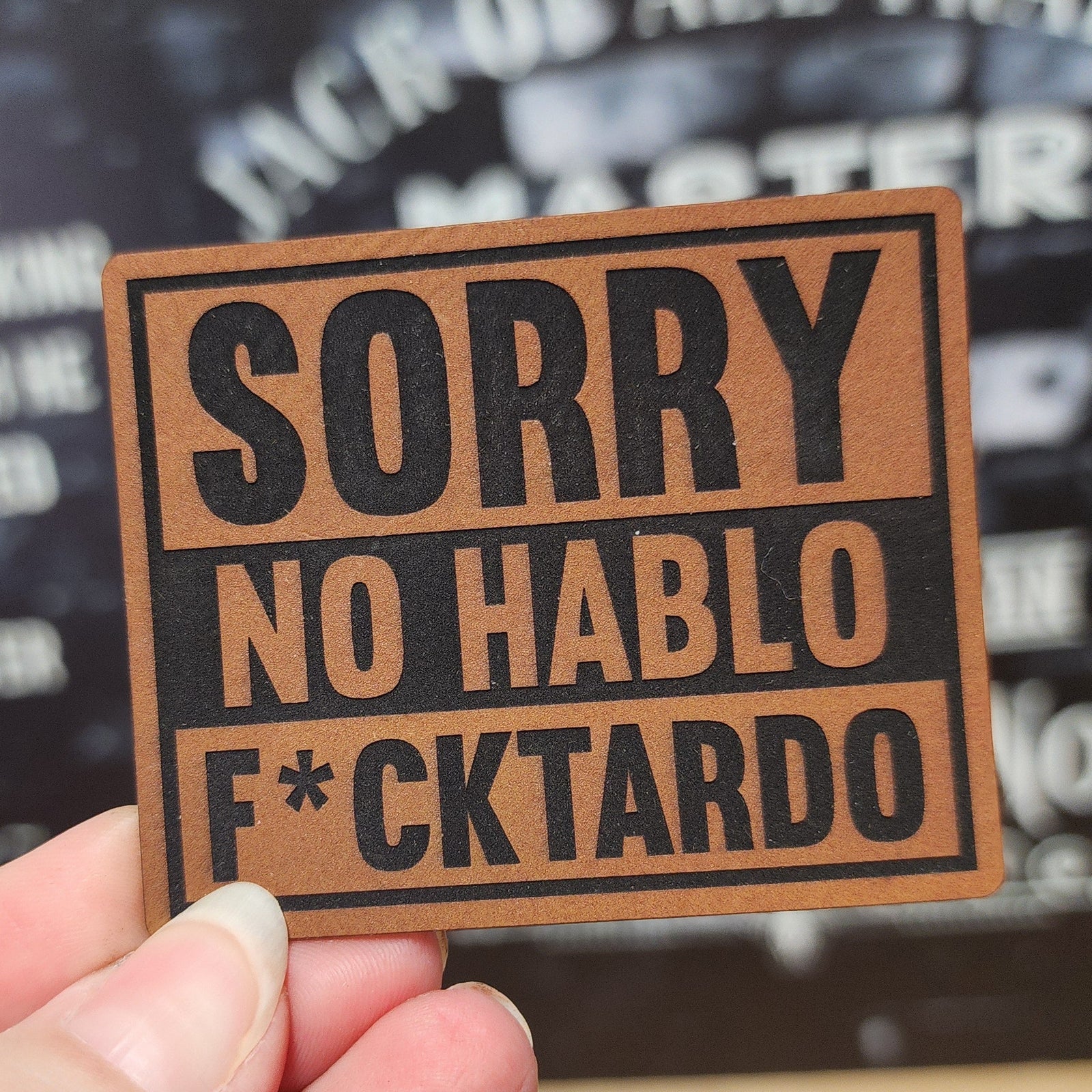 Humorous leatherette hat patch saying 'Sorry No Hablo F*cktardo' perfect for funny hat lovers.