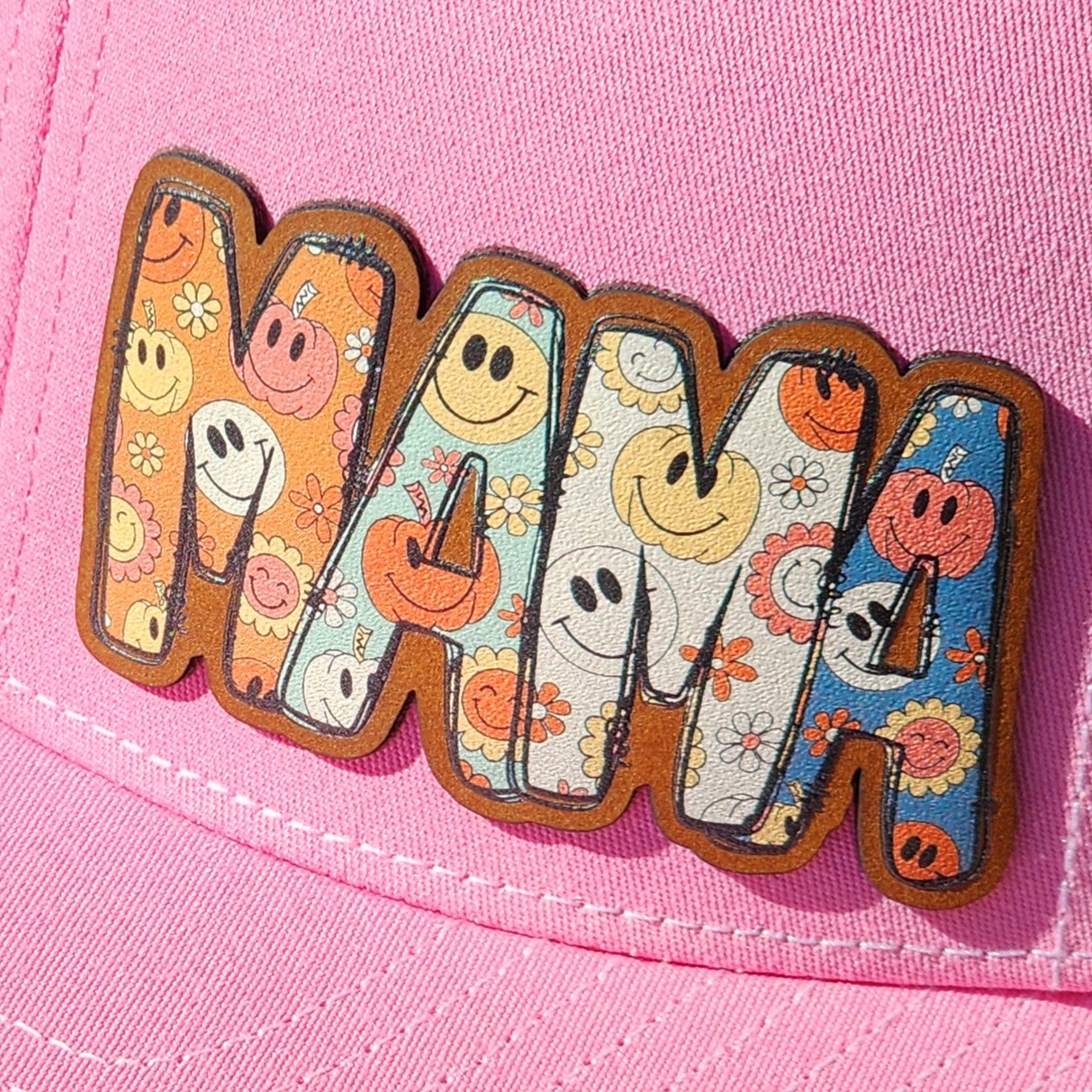 Mama leatherette hat patch with retro flower and smiley face design on pink cap, perfect gift for mothers.