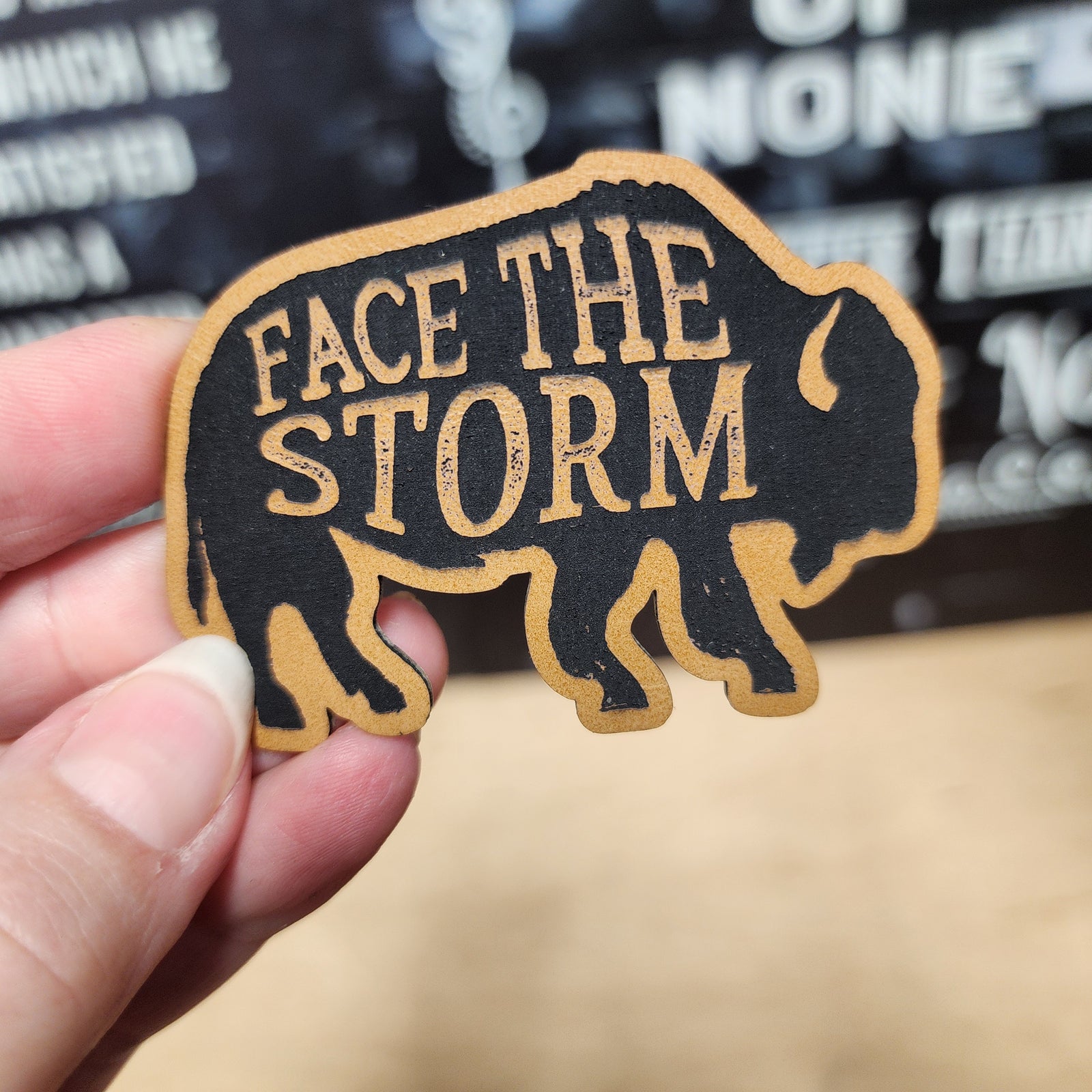 Face the Storm leatherette hat patch featuring a bold bison design for outdoor and adventure enthusiasts.