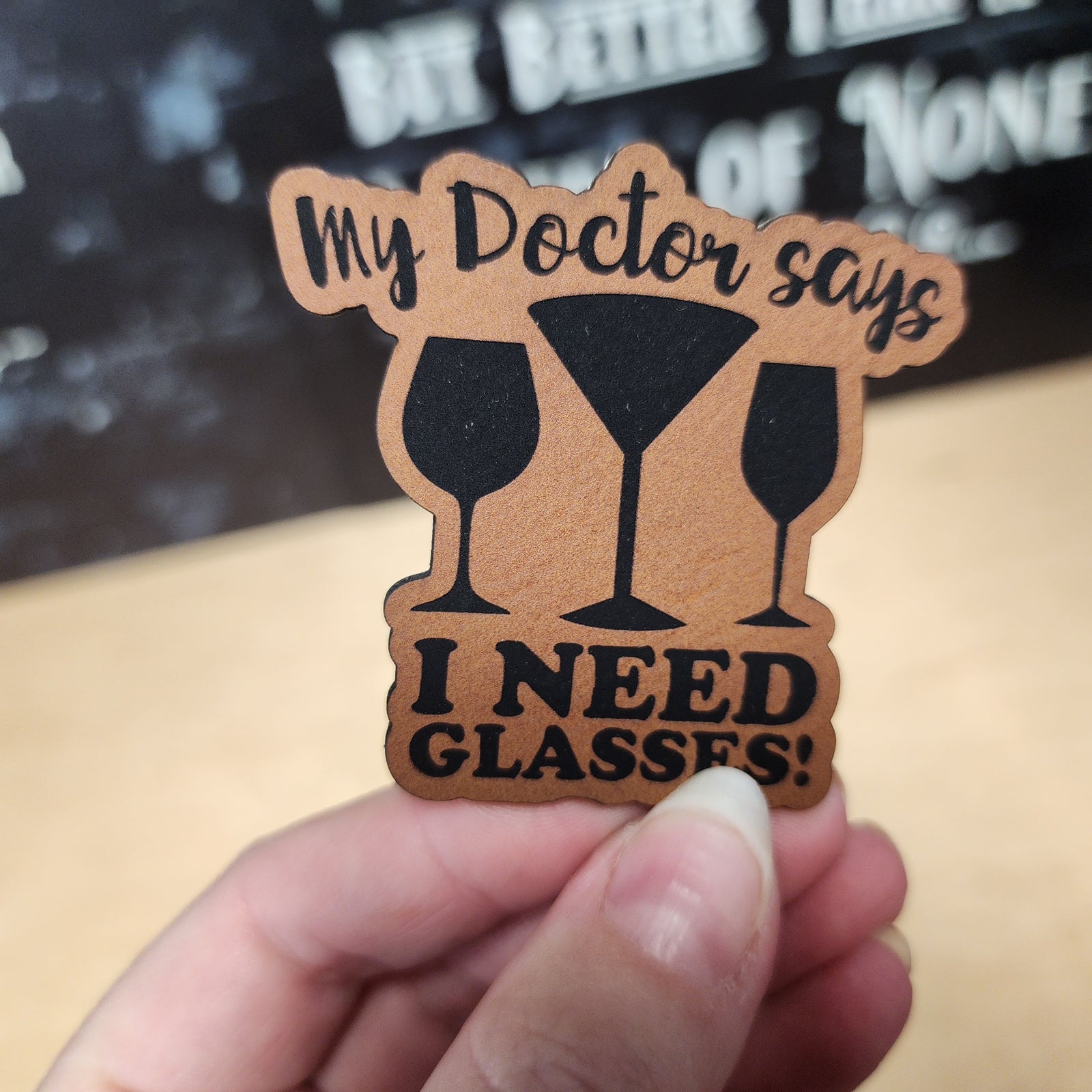 Funny leatherette hat patch, 'My Doctor Says I Need Glasses,' perfect for party lovers and gift ideas.