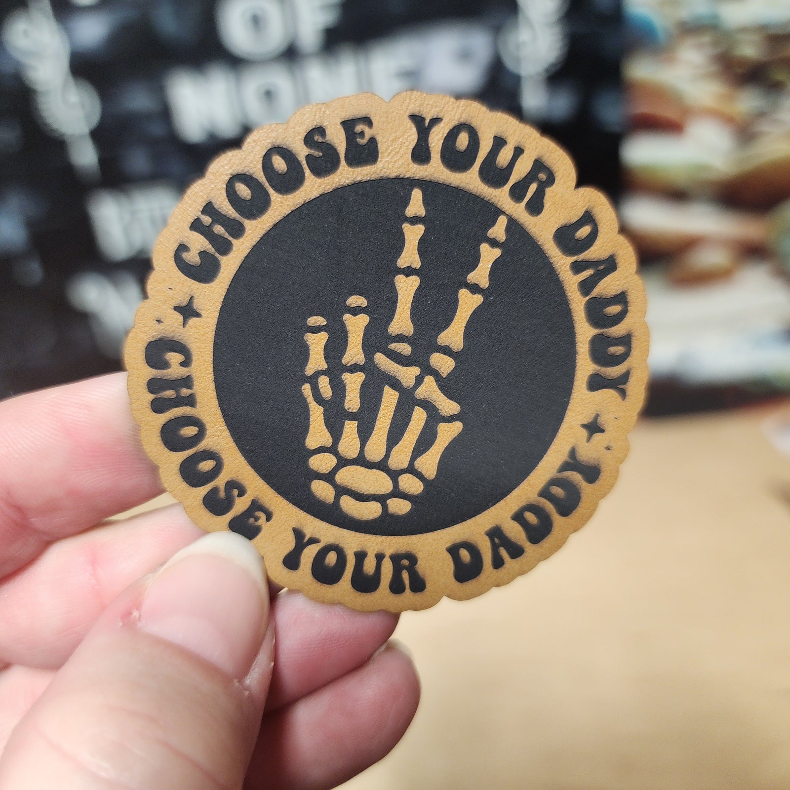 Choose Your Daddy leatherette hat patch featuring a skeleton hand, perfect for edgy fashion and Halloween vibes.