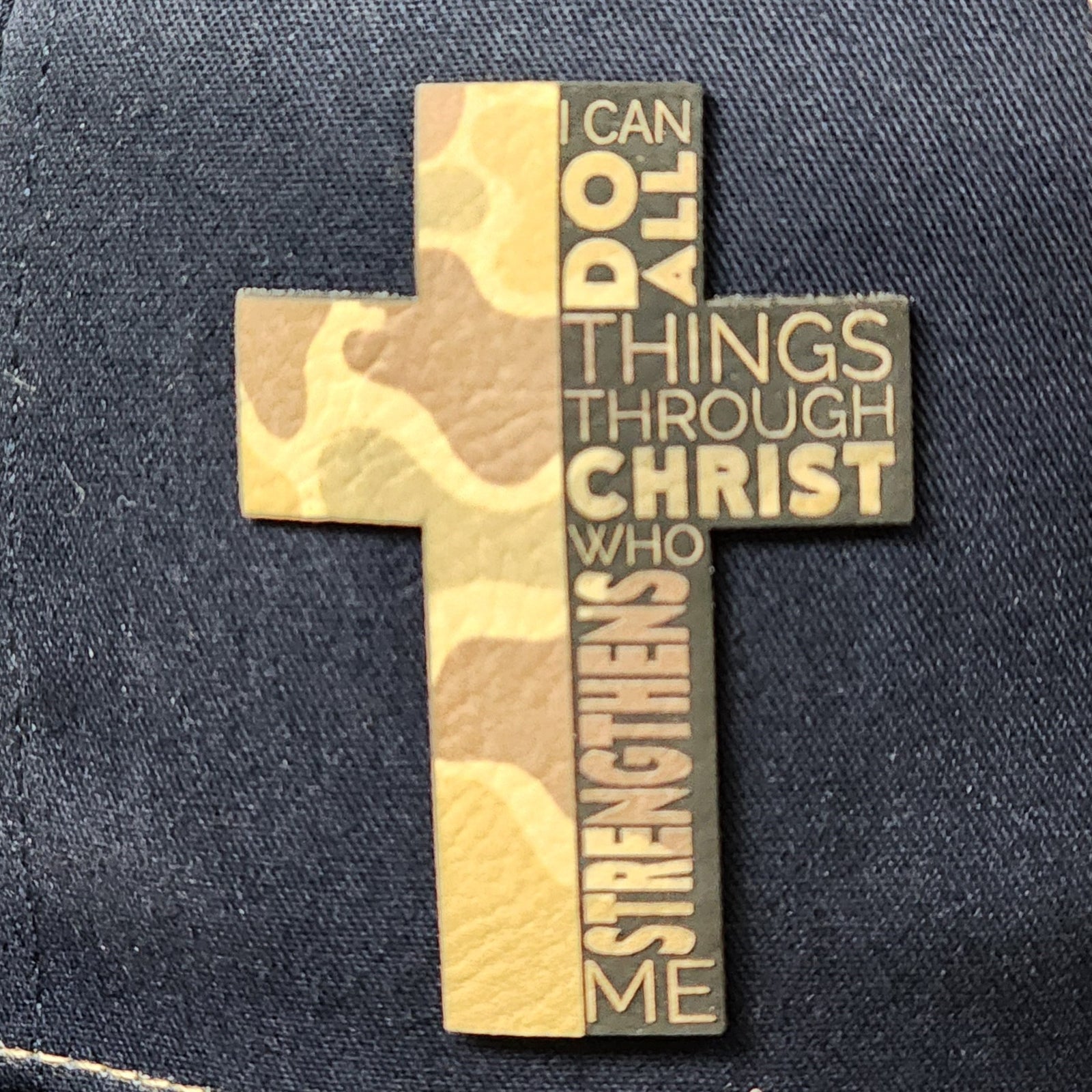 Leatherette cross hat patch featuring camo design and scripture, perfect for faith-based fashion or gifts.