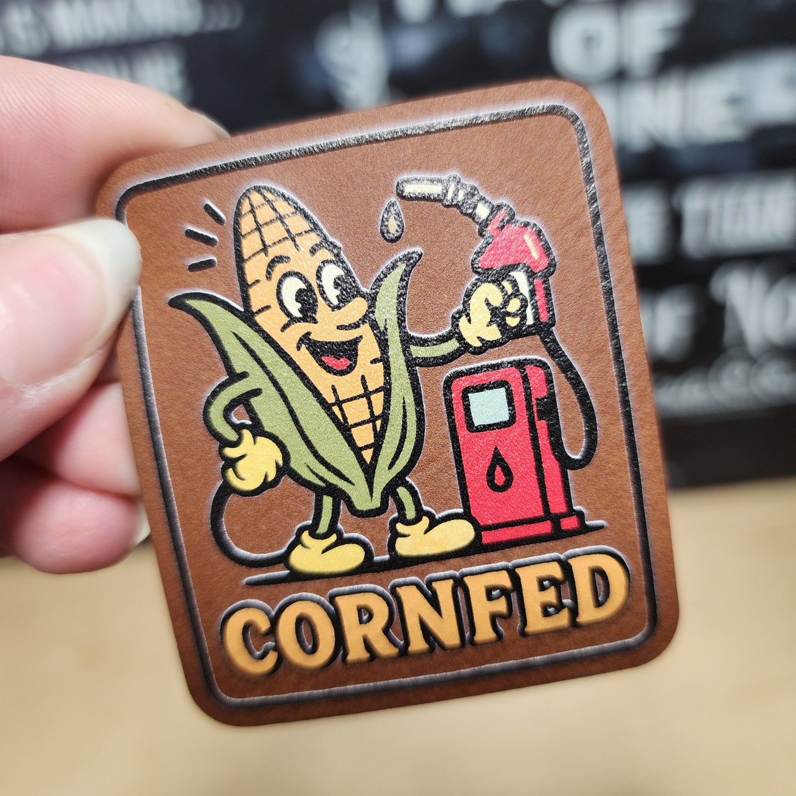 Cornfed corn character leatherette hat patch with fuel pump design for agriculture and farming enthusiasts.