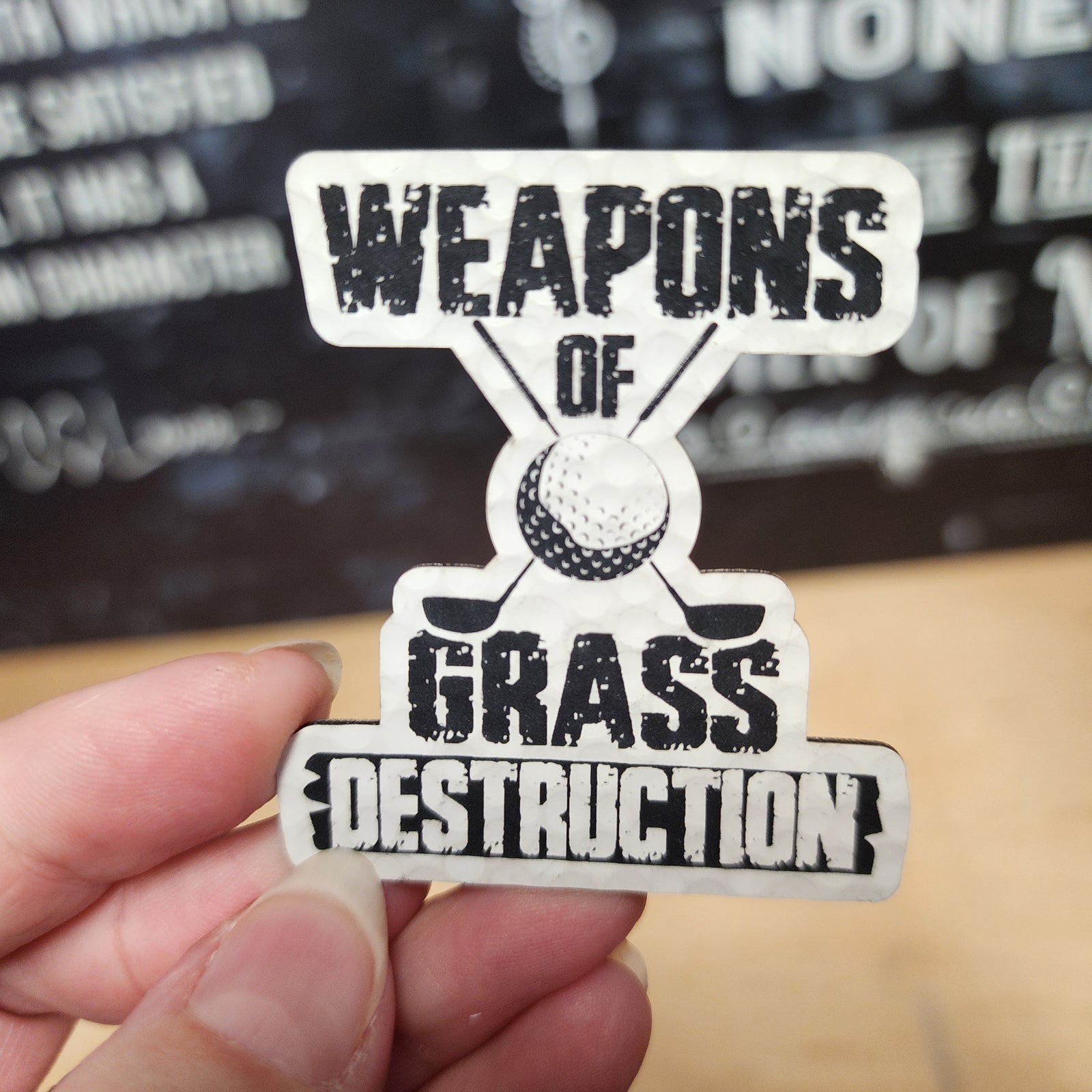 Weapons of Grass Destruction leatherette hat patch, perfect for golf lovers and outdoor enthusiasts.