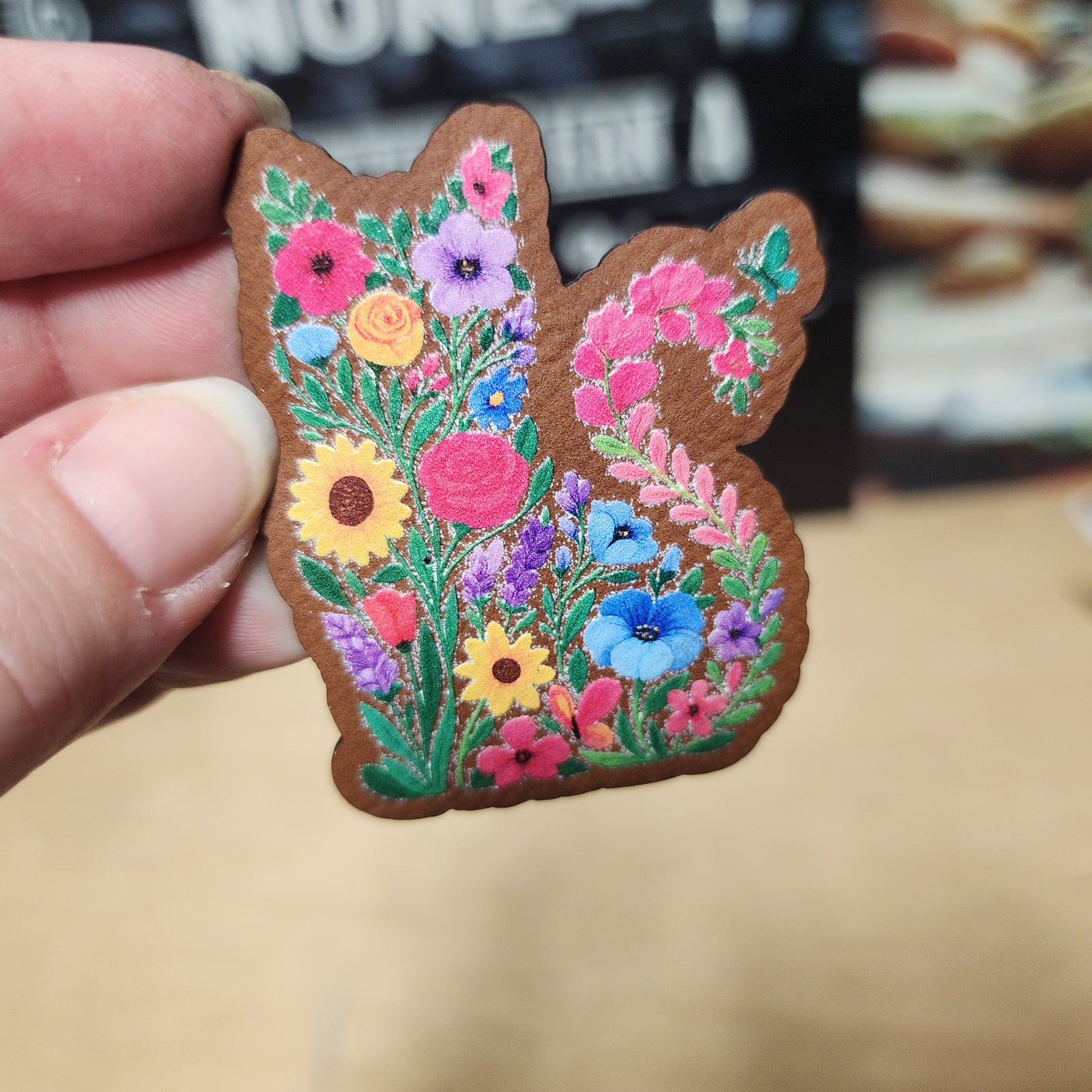 Colorful floral leatherette hat patch featuring a cat shape, perfect for embellishing hats or bags.