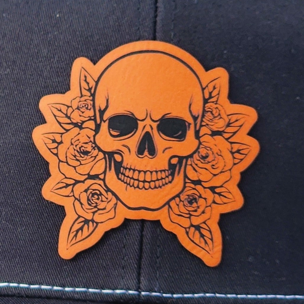 Skull and rose leatherette hat patch for edgy fashion and unique style in headwear accessories.
