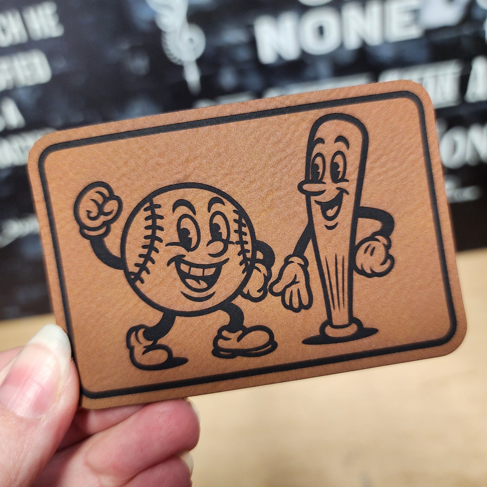 Baseball and bat leatherette hat patch, perfect for sports lovers and baseball enthusiasts.