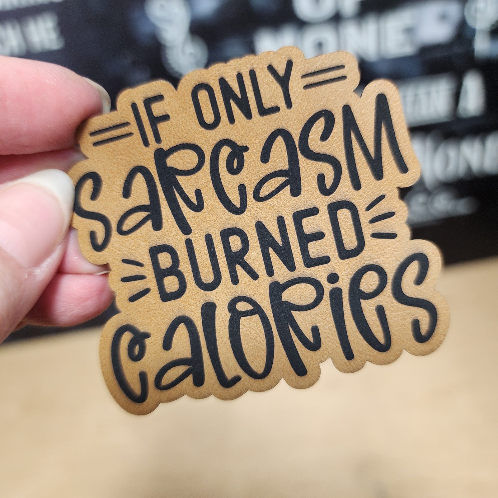 Funny leatherette hat patch with the quote 'If only sarcasm burned calories' for humor lovers.