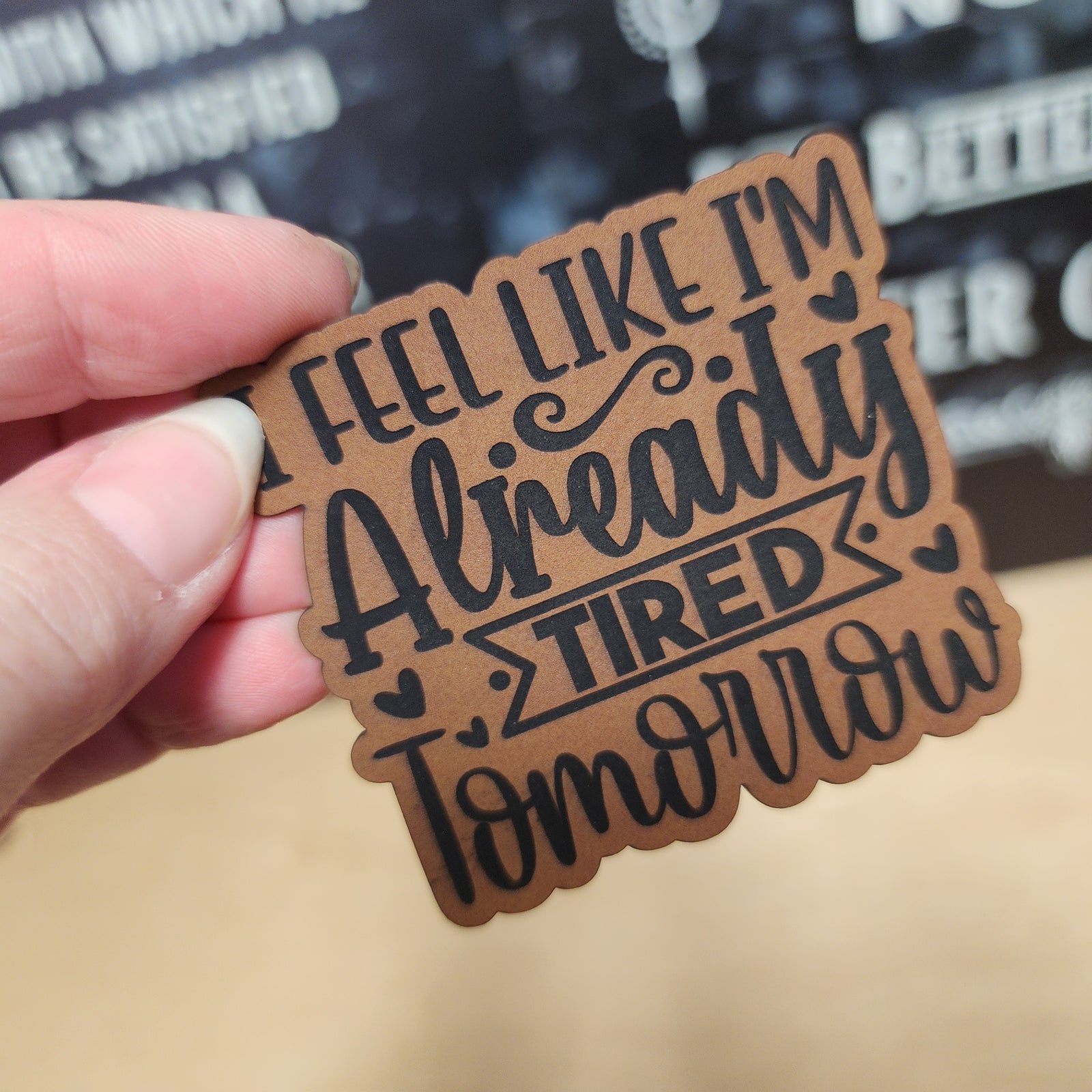 Leatherette humor patch that reads 'Feel like I'm already tired tomorrow,' perfect for quirky hat designs.