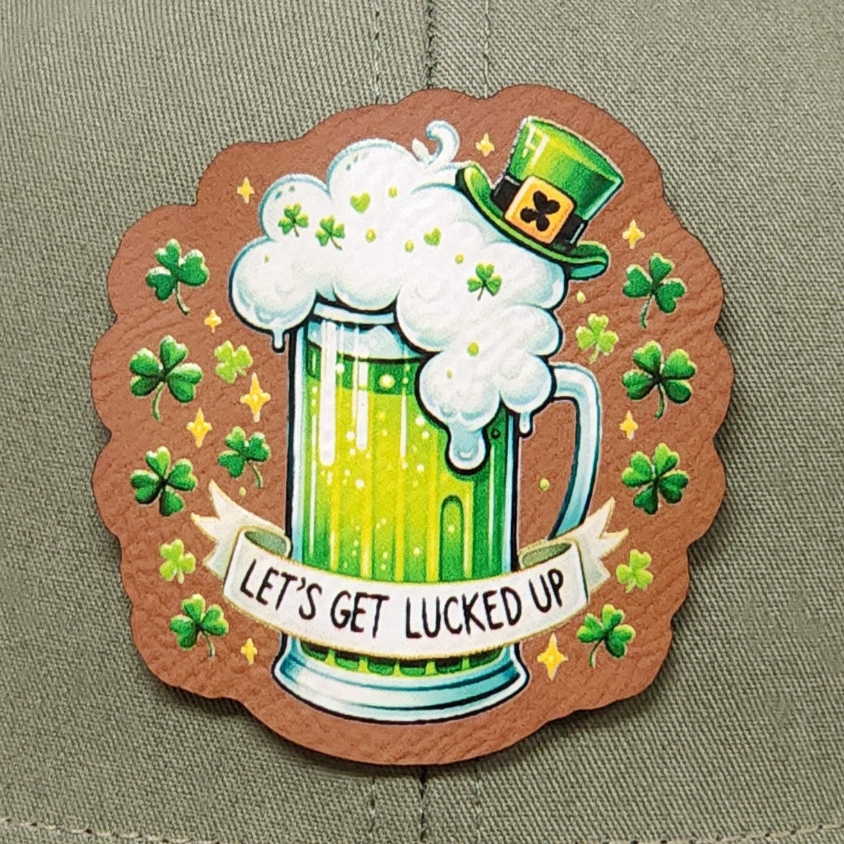 St. Patrick's Day leatherette hat patch featuring green beer and clovers with 'Let's Get Lucky Up' design.