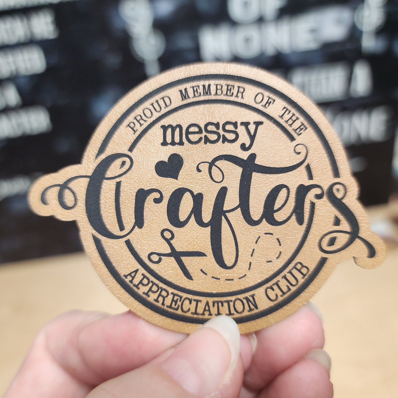 Messy Crafters Appreciation Club leatherette hat patch for creative enthusiasts and DIY lovers.