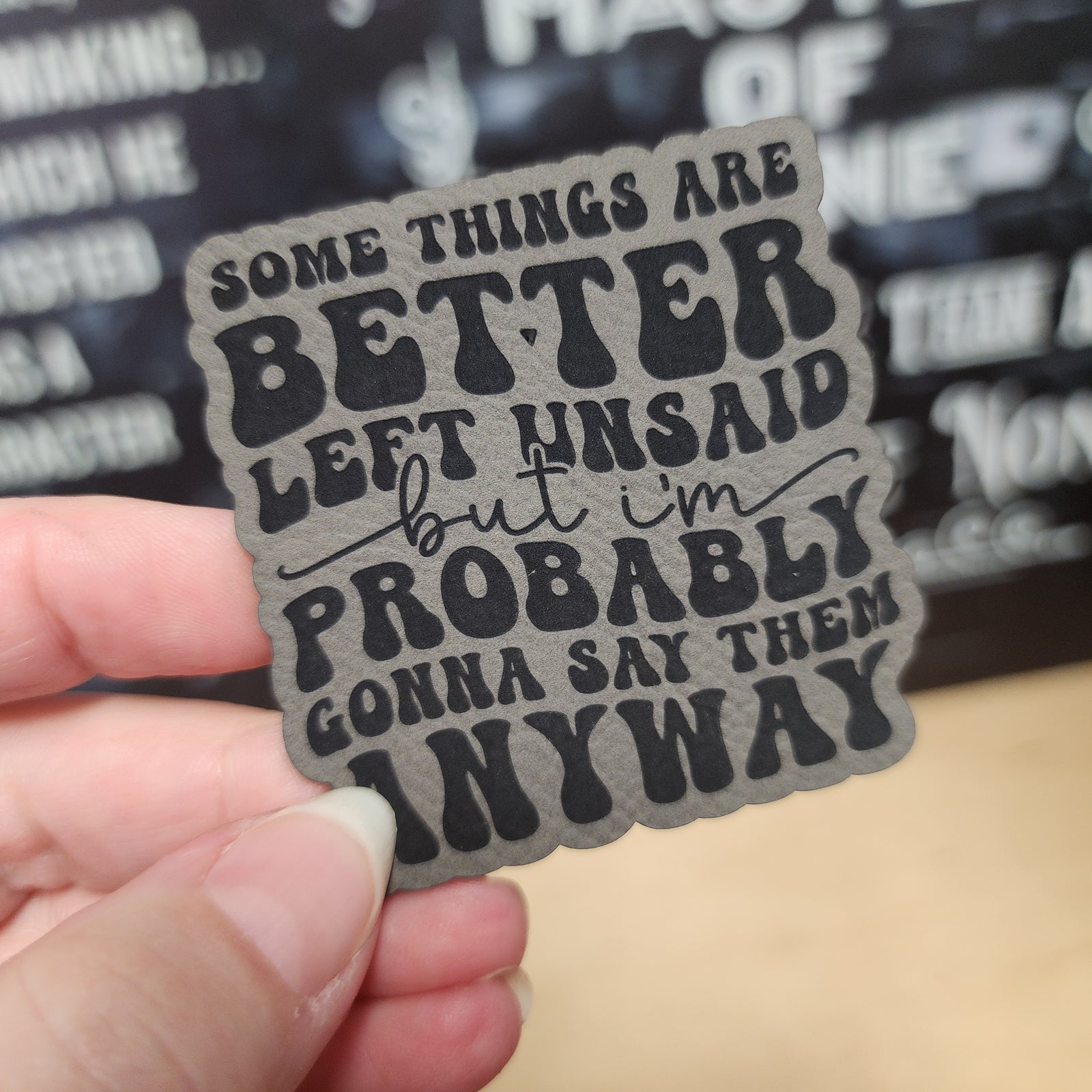 Inspirational leatherette hat patch with the quote: 'Some things are better left unsaid, but I'm probably gonna say them anyway.'