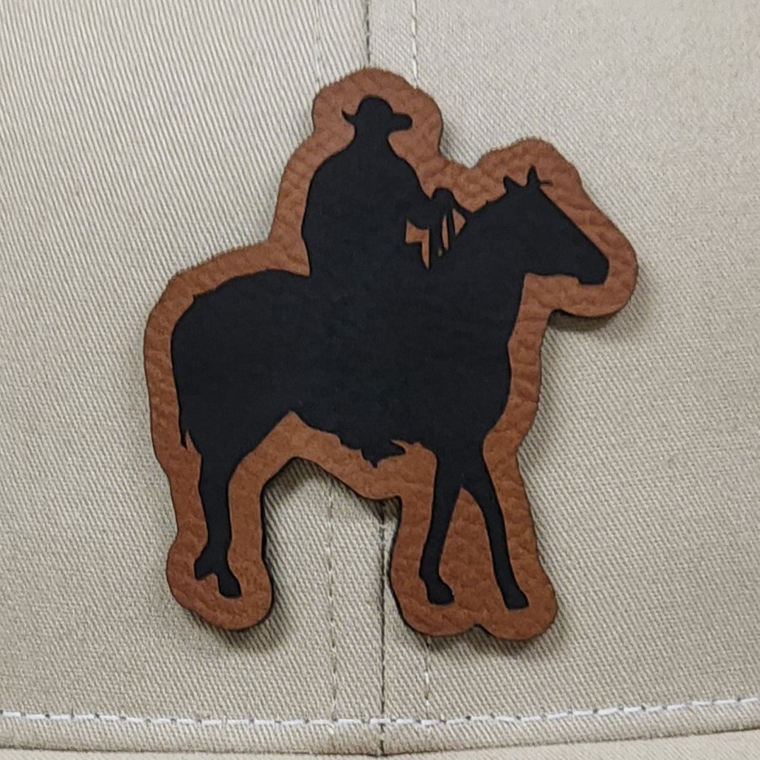 Cowboy on horseback leatherette hat patch for western style caps, perfect for ranchers and outdoor enthusiasts.