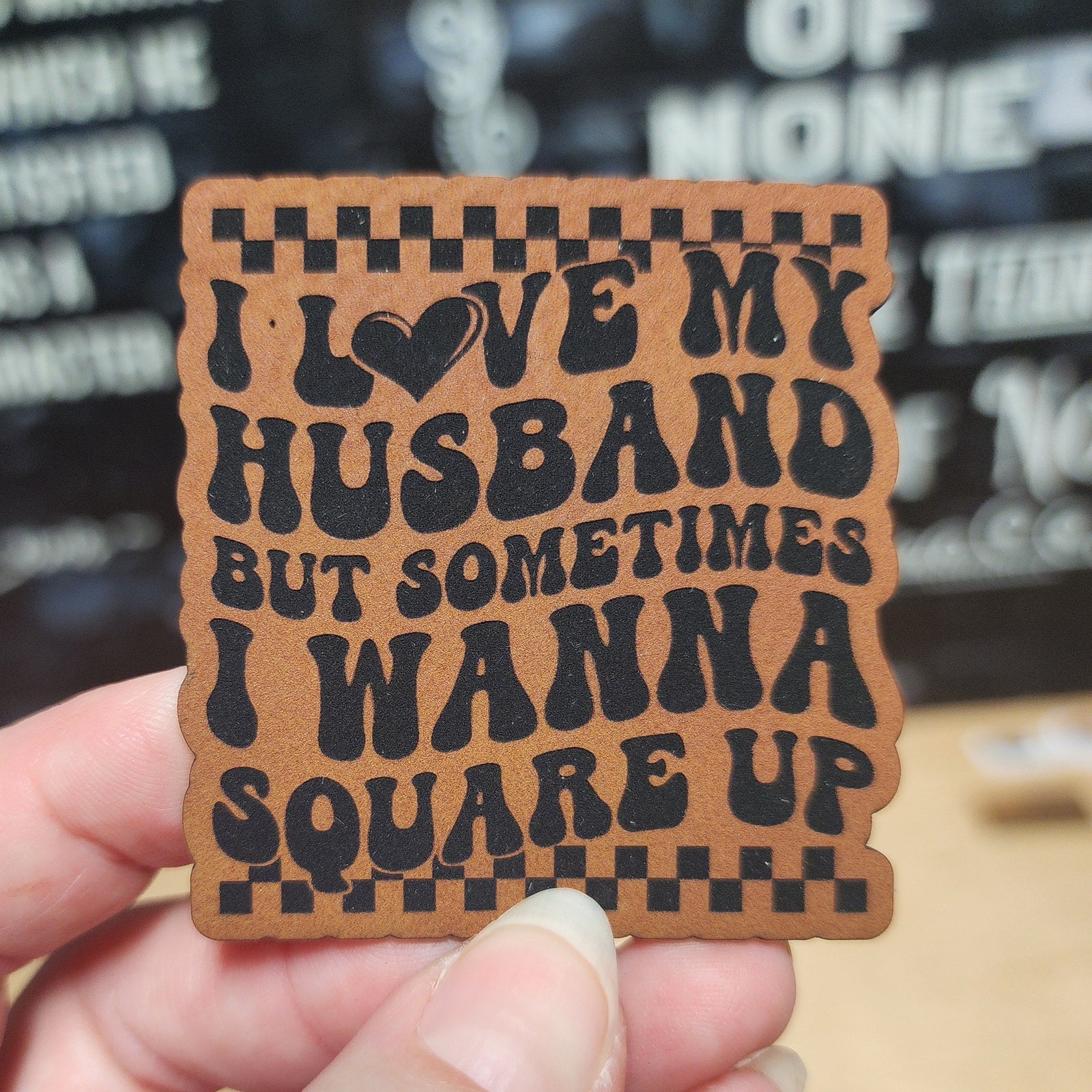 Funny leatherette hat patch, 'I Love My Husband But Sometimes I Wanna Square Up,' perfect for quirky gifts.