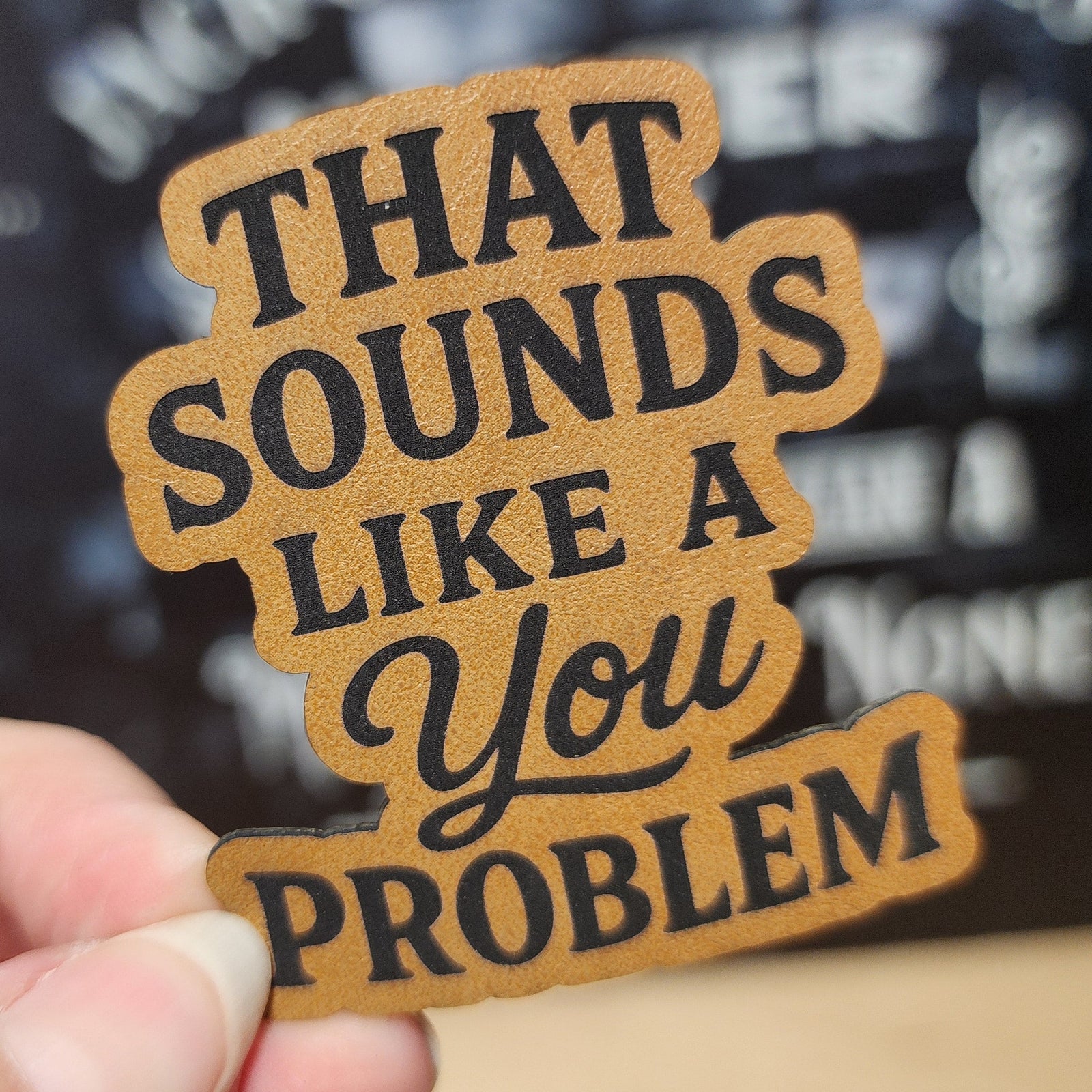 Funny leatherette hat patch that says 'That Sounds Like a You Problem,' perfect for humorous accessories.