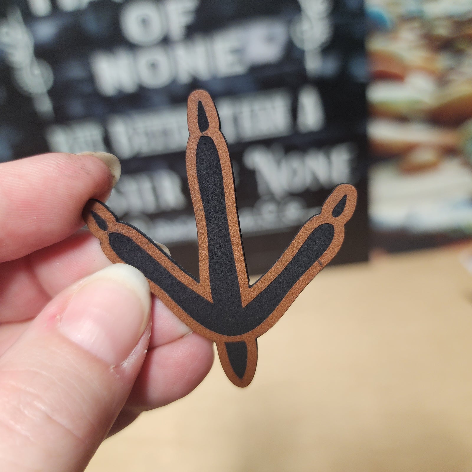 Dinosaur claw leatherette hat patch for hats, bags, and accessories, perfect for Jurassic-themed apparel.