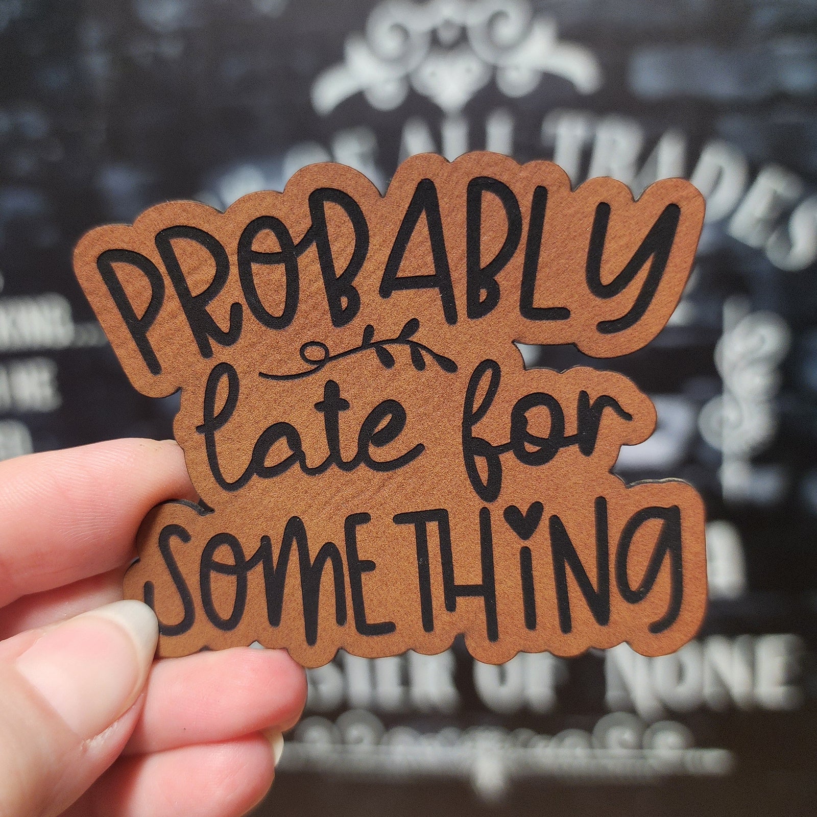 Funny leatherette hat patch featuring the phrase 'Probably late for something', perfect for casual hats.