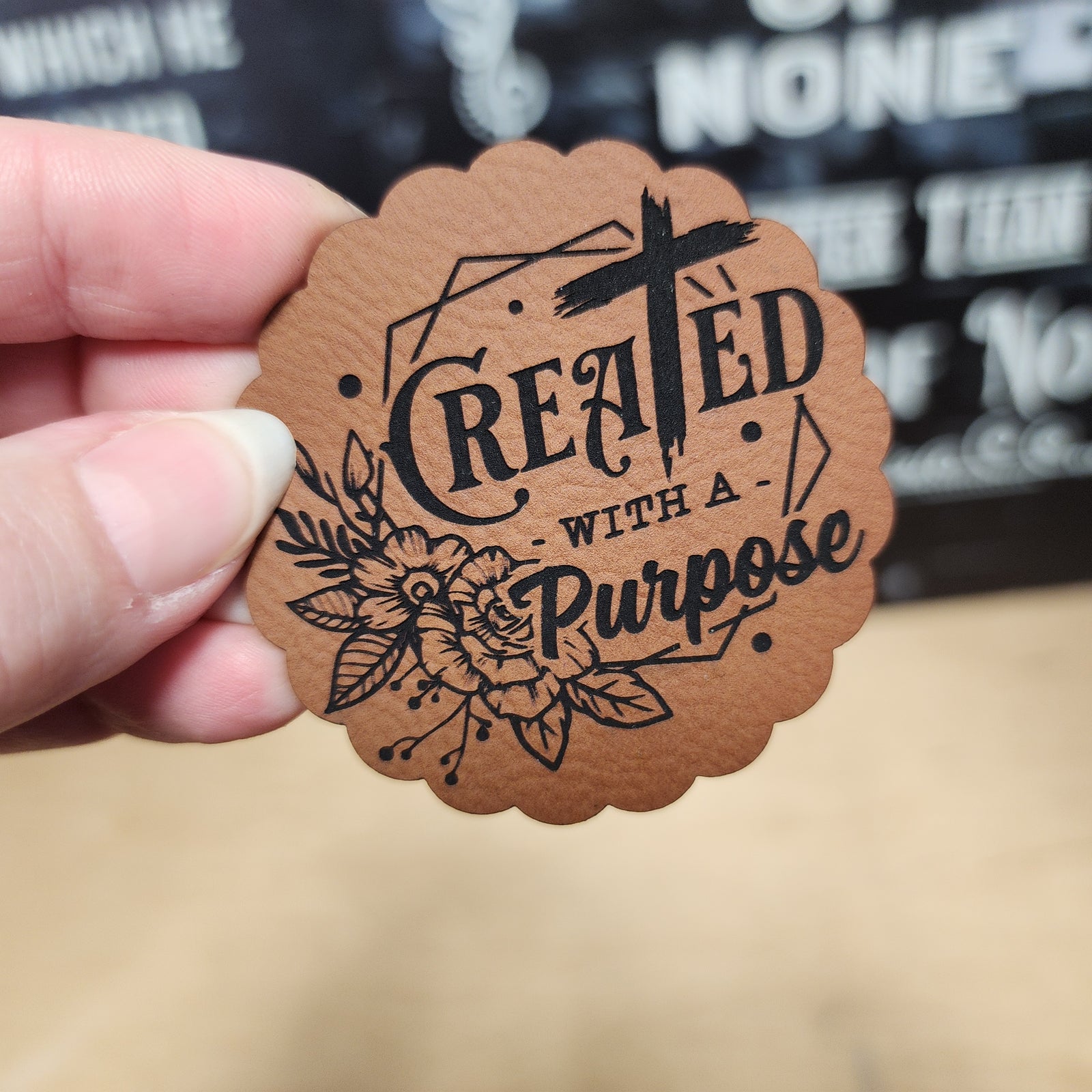 Created with a Purpose leatherette patch, perfect for hats or bags, featuring floral design and bold typography.