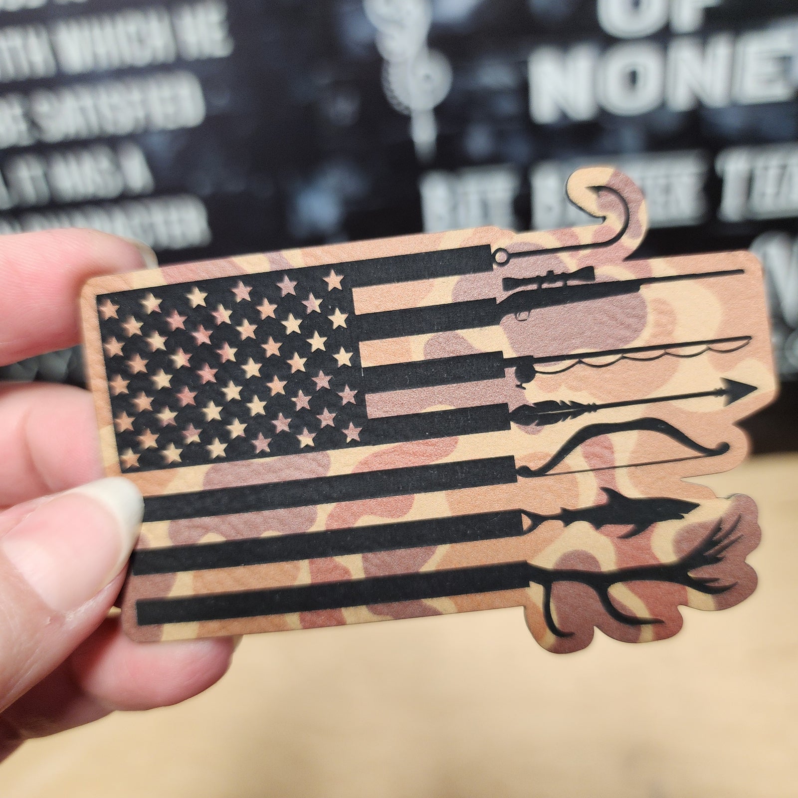 Patriotic leatherette hat patch featuring USA flag design with camo and weapon motifs, perfect for flag enthusiasts.