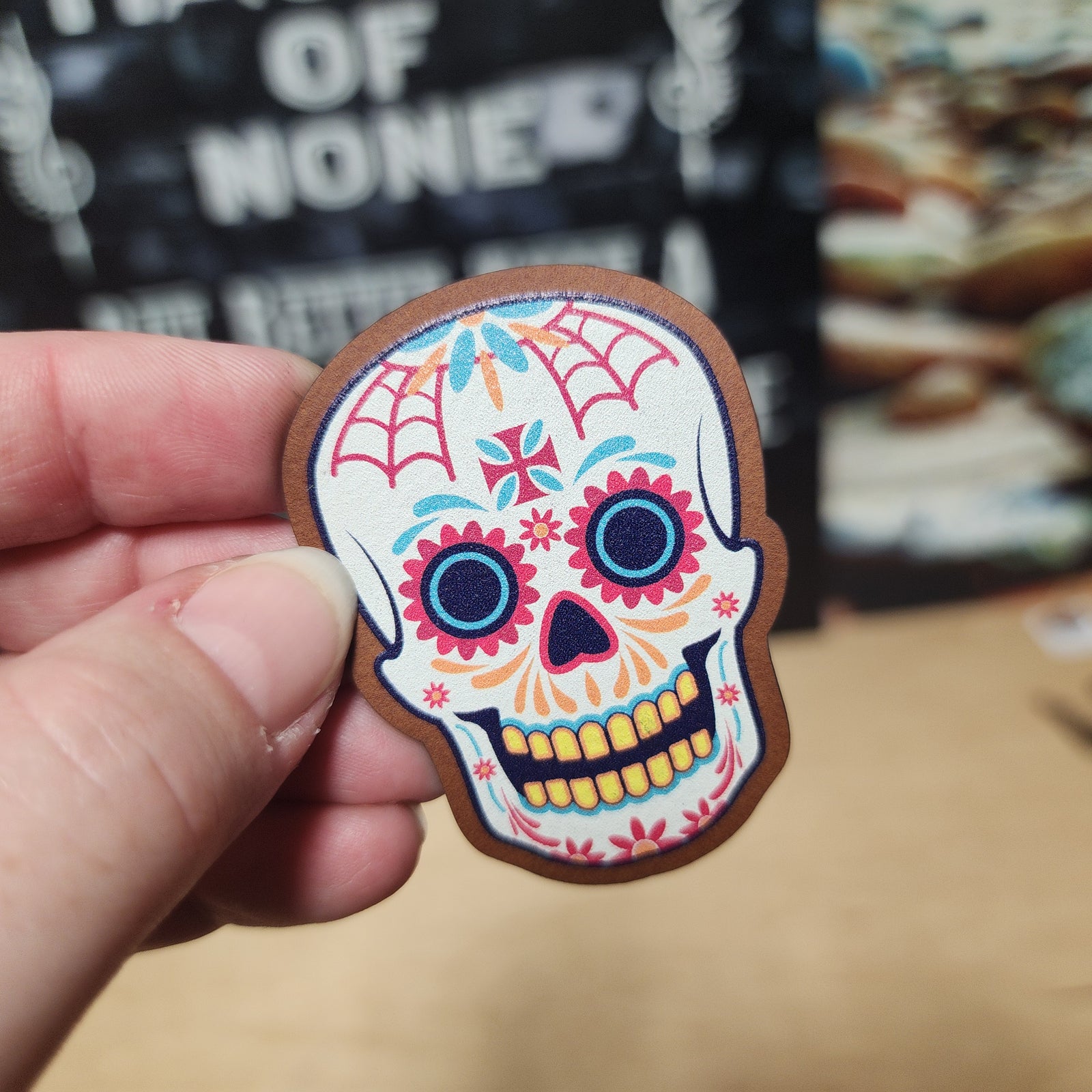 Colorful sugar skull leatherette patch, perfect for Día de los Muertos celebrations and Halloween accessories.