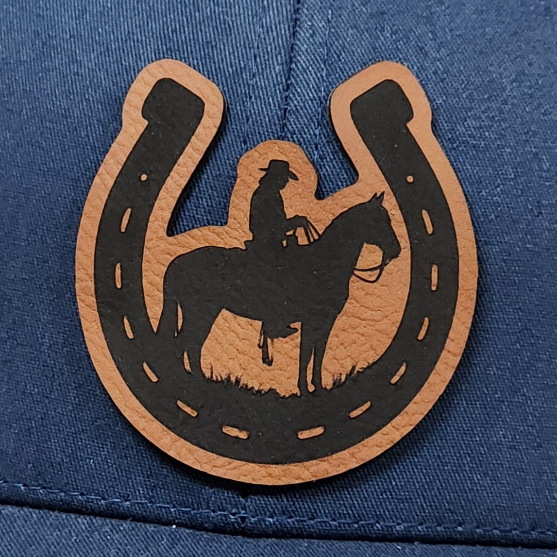 Cowboy horse leatherette hat patch for equestrian lovers, featuring a silhouette of a rider on horseback.