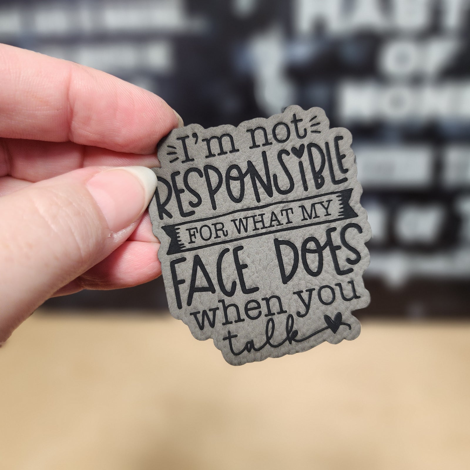 Funny leatherette hat patch saying 'I’m not responsible for what my face does when you talk' for unique caps.
