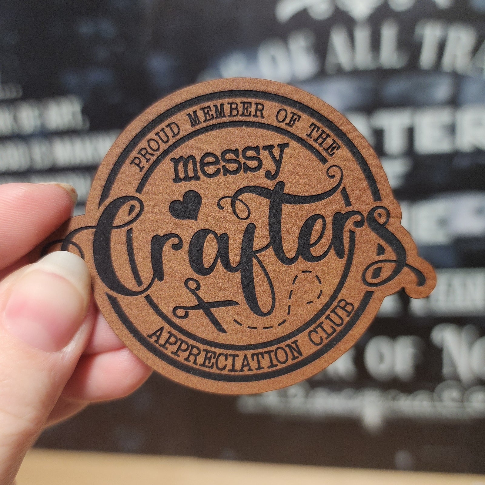 Messy Crafters leatherette hat patch for crafting enthusiasts, proud member appreciation club design.
