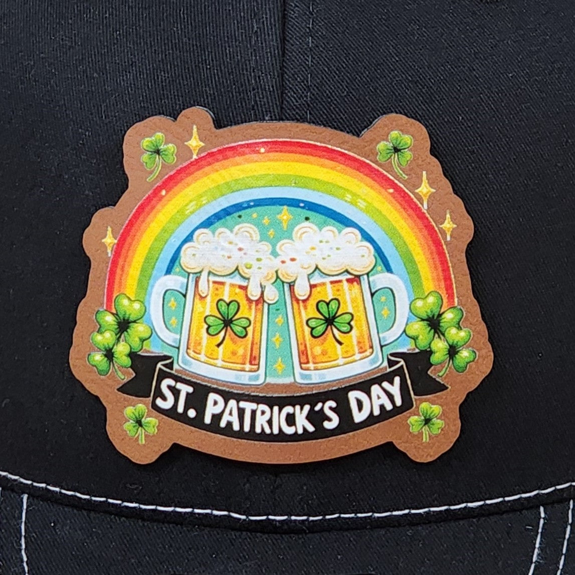 St. Patrick's Day leatherette hat patch featuring beer mugs, shamrocks, and a vibrant rainbow design.