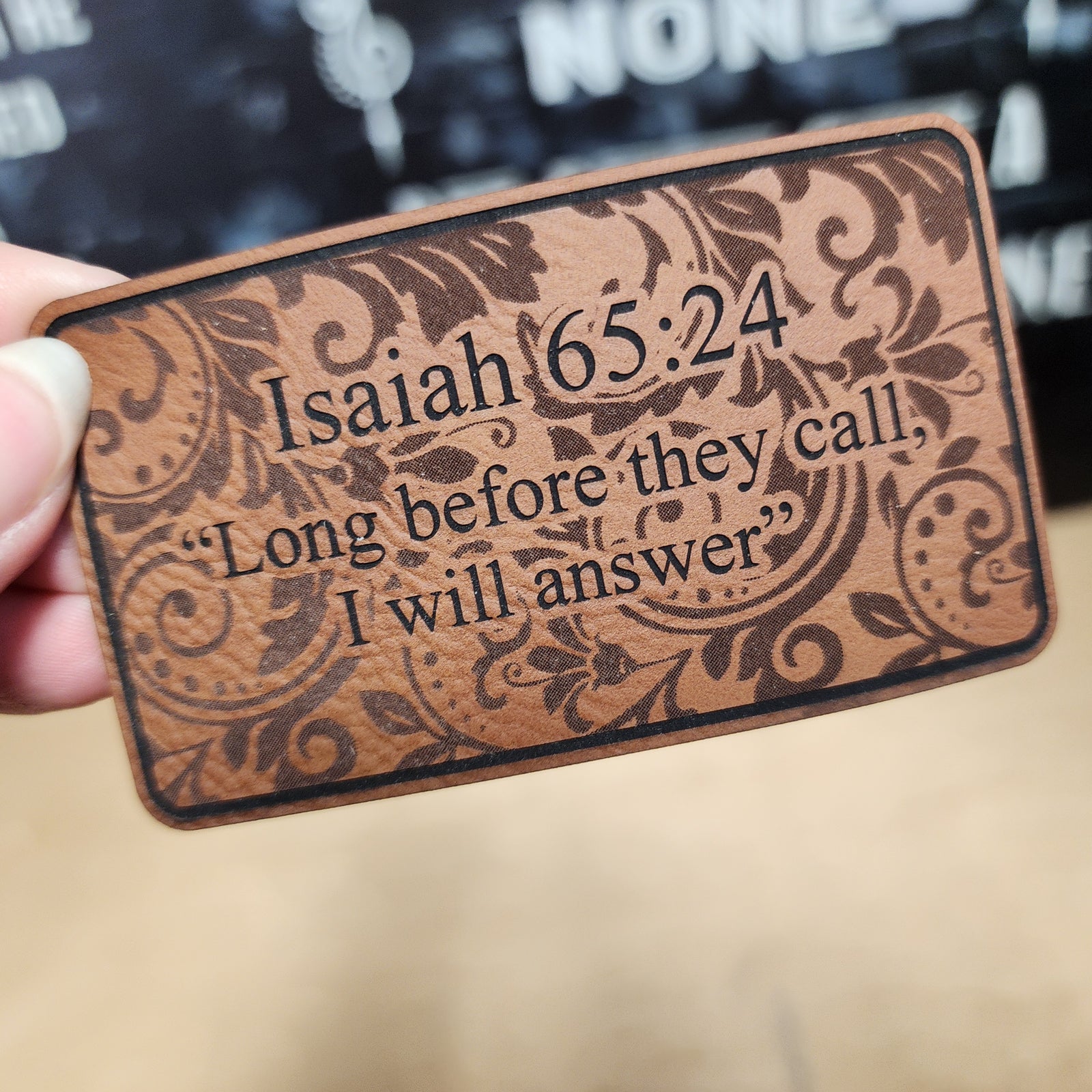 Inspirational leatherette hat patch with Isaiah 65:24 quote, perfect for hats and Christian accessories.