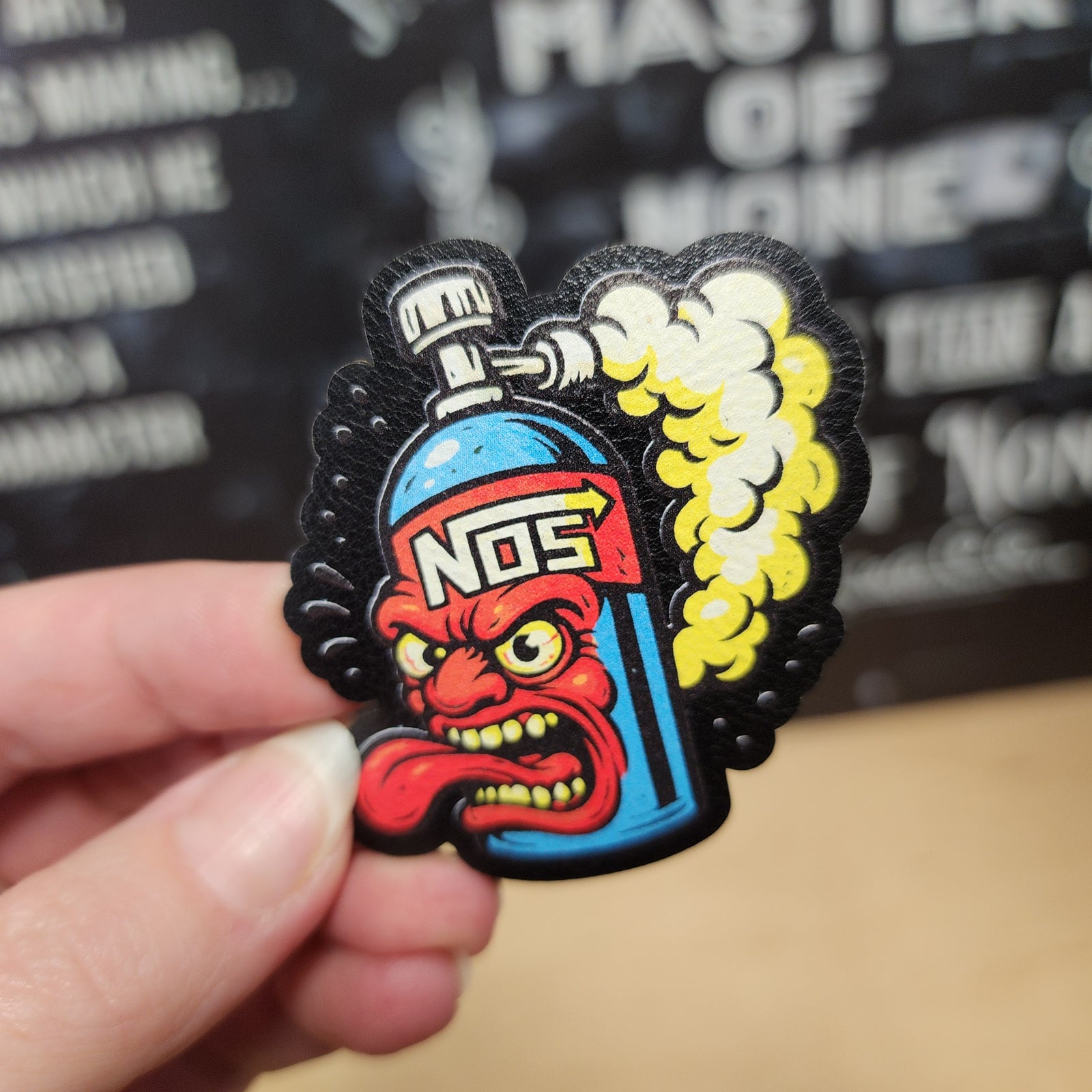 NOS gas canister leatherette hat patch with fierce cartoon character, perfect for automotive enthusiasts and custom gear.