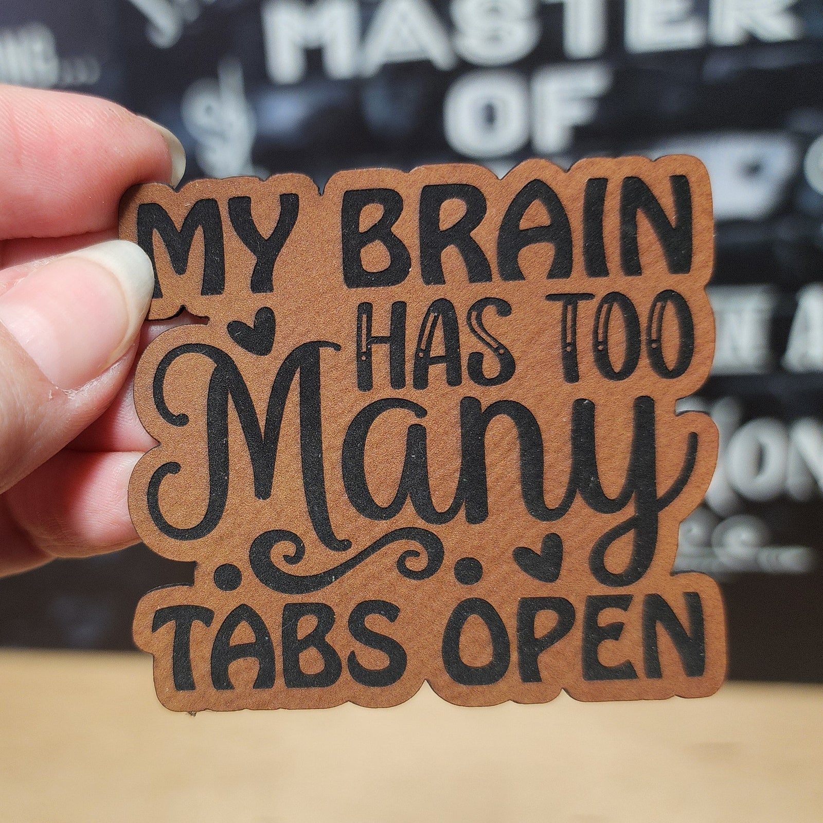 My Brain Has Too Many Tabs Open leatherette hat patch, humorous accessory for creative minds and busy individuals.