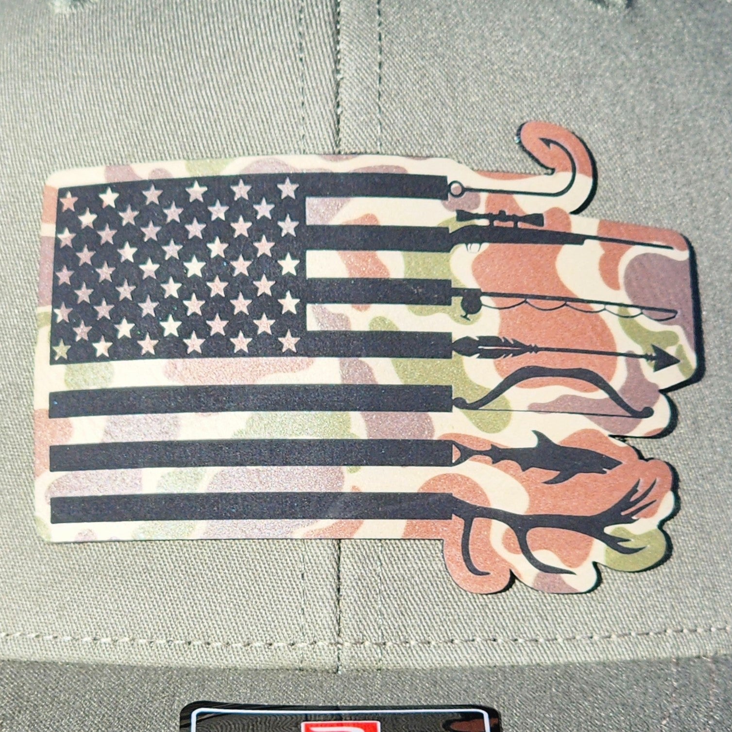 American flag leatherette hat patch with camo design and fishing hooks, perfect for outdoor enthusiasts.