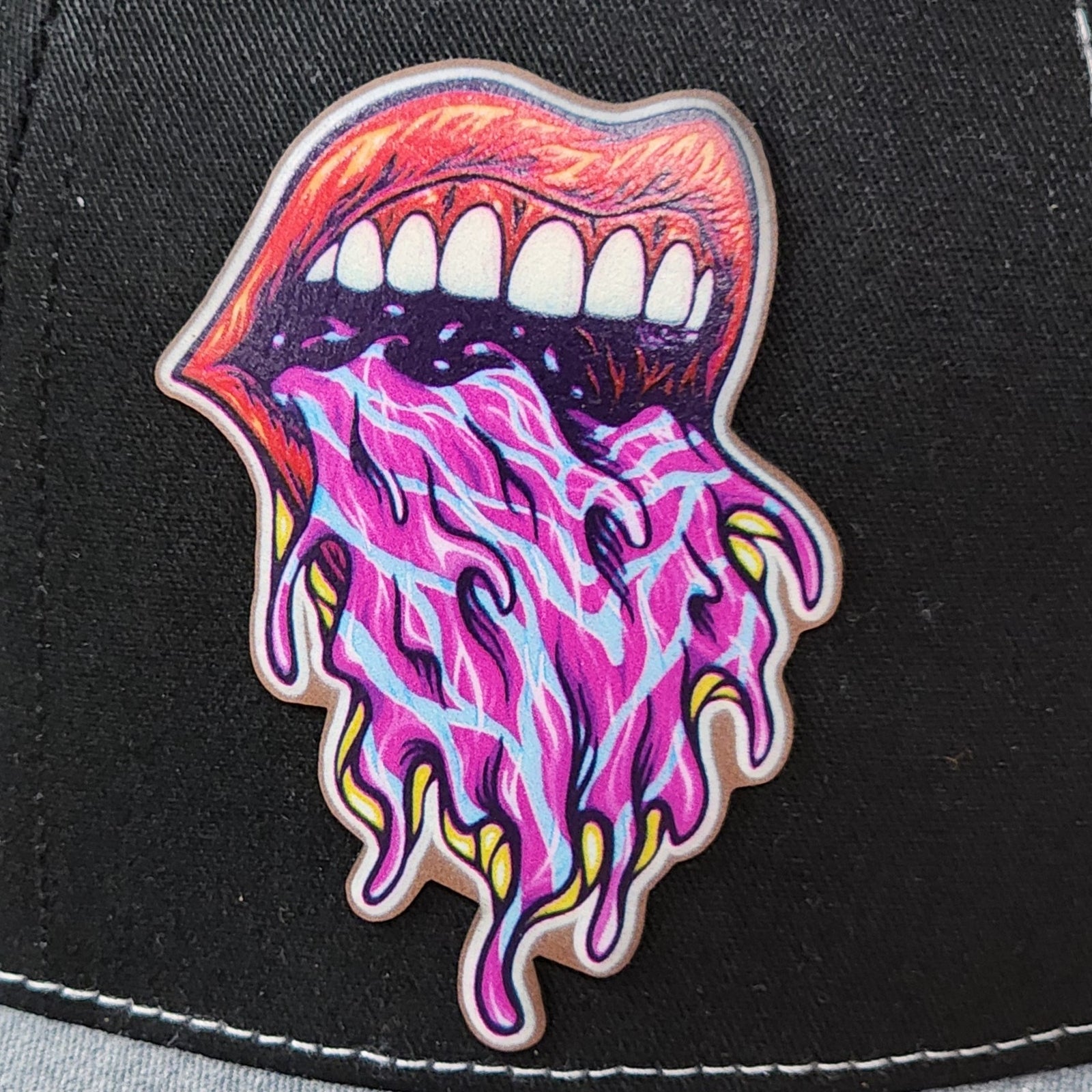 Colorful dripping mouth hat patch, perfect for edgy caps, unique leatherette patch for fashion-forward style.