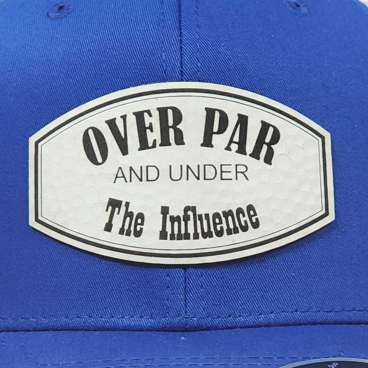 Over Par and Under The Influence leatherette hat patch for golf enthusiasts, stylish and humorous accessory.