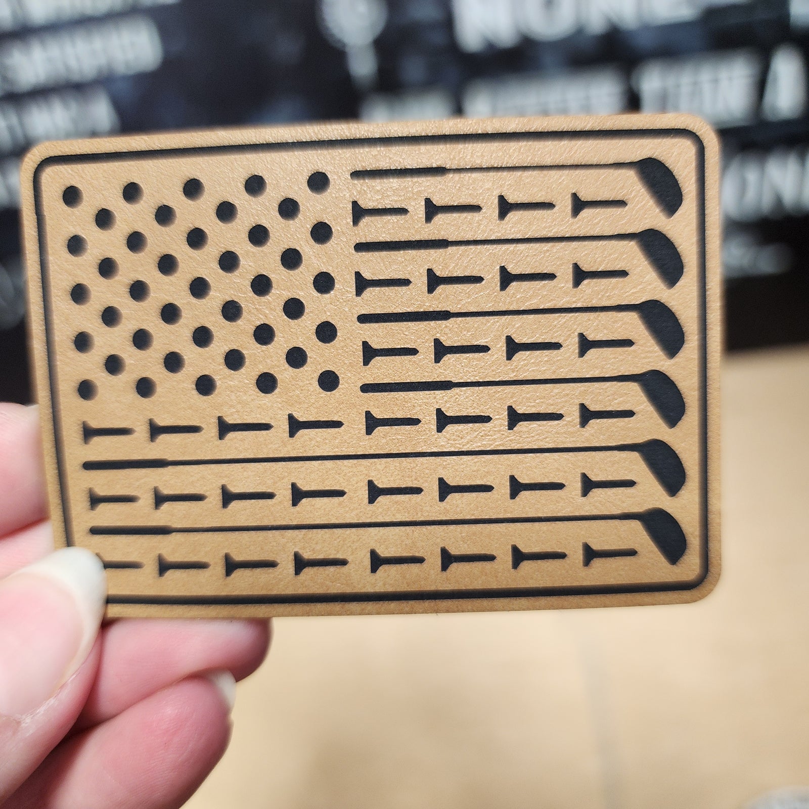 Leatherette American flag hat patch with golf club design, perfect for hats and outdoor enthusiasts.