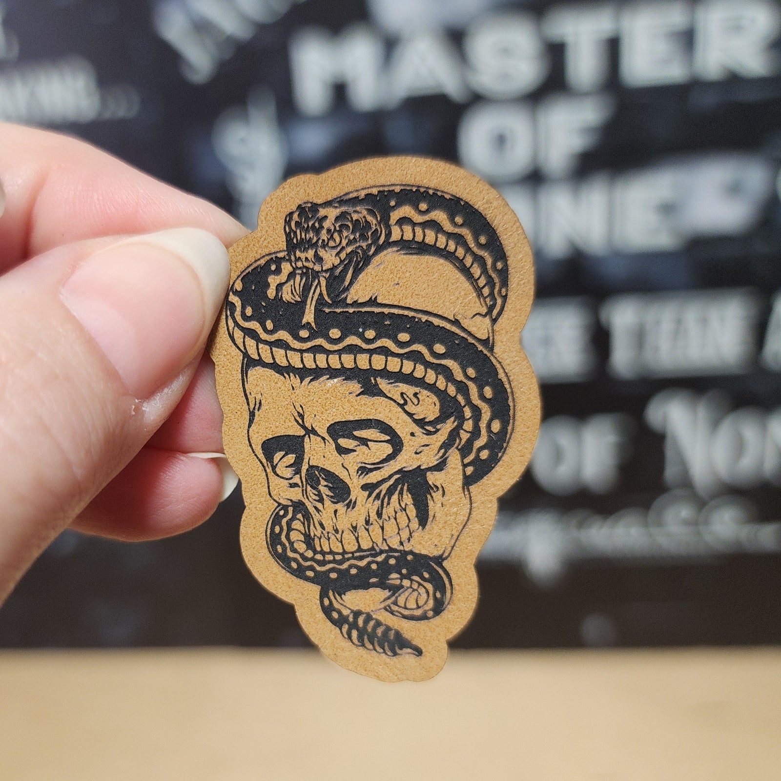 Leatherette skull patch with snake design, perfect for edgy hats, biker style, or unique fashion accessories.